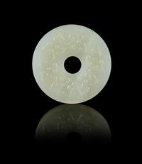 A Chinese White Jade Reticulated Bi Pendant