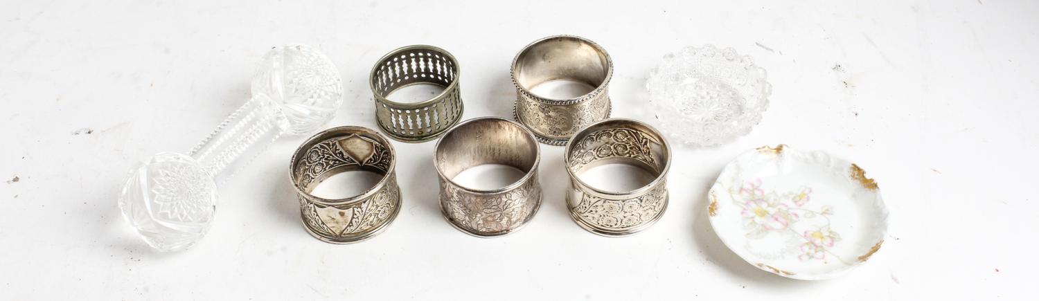 A Group of Four Silver Napkin Rings, various makers, comprising three English examples and a Chinese example, together with a silvered