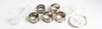 A Group of Four Silver Napkin Rings, various makers, comprising three English examples and a Chinese example, together with a silvered