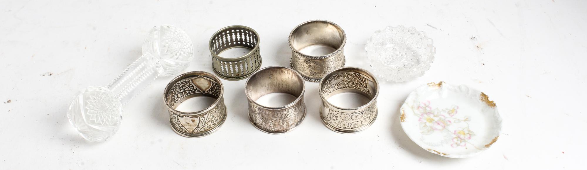 A Group of Four Silver Napkin Rings, various makers, comprising three English examples and a Chinese example, together with a silvered