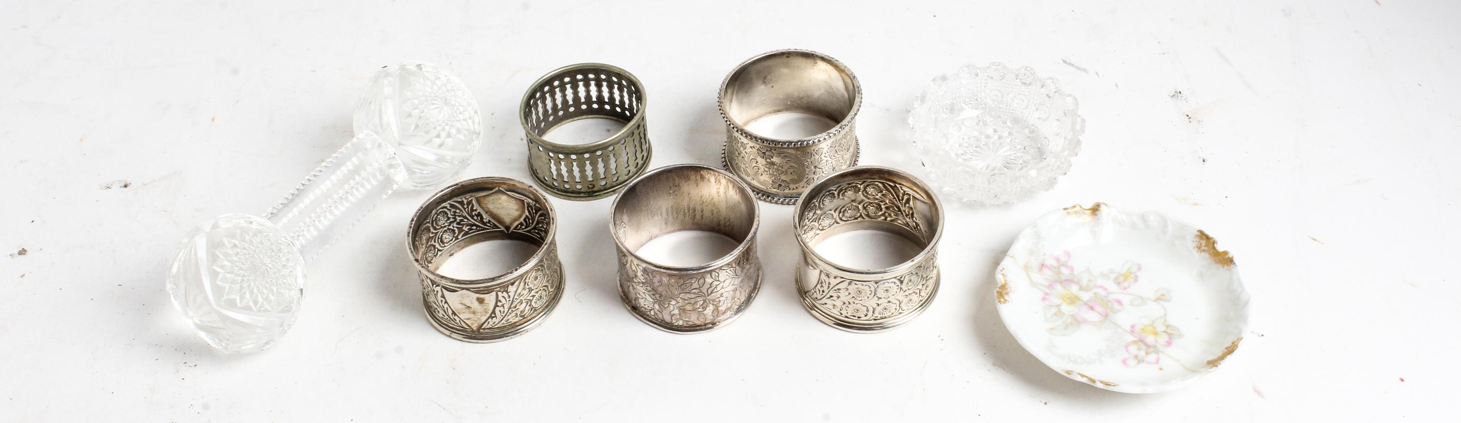 A Group of Four Silver Napkin Rings, various makers, comprising three English examples and a Chinese example, together with a silvered