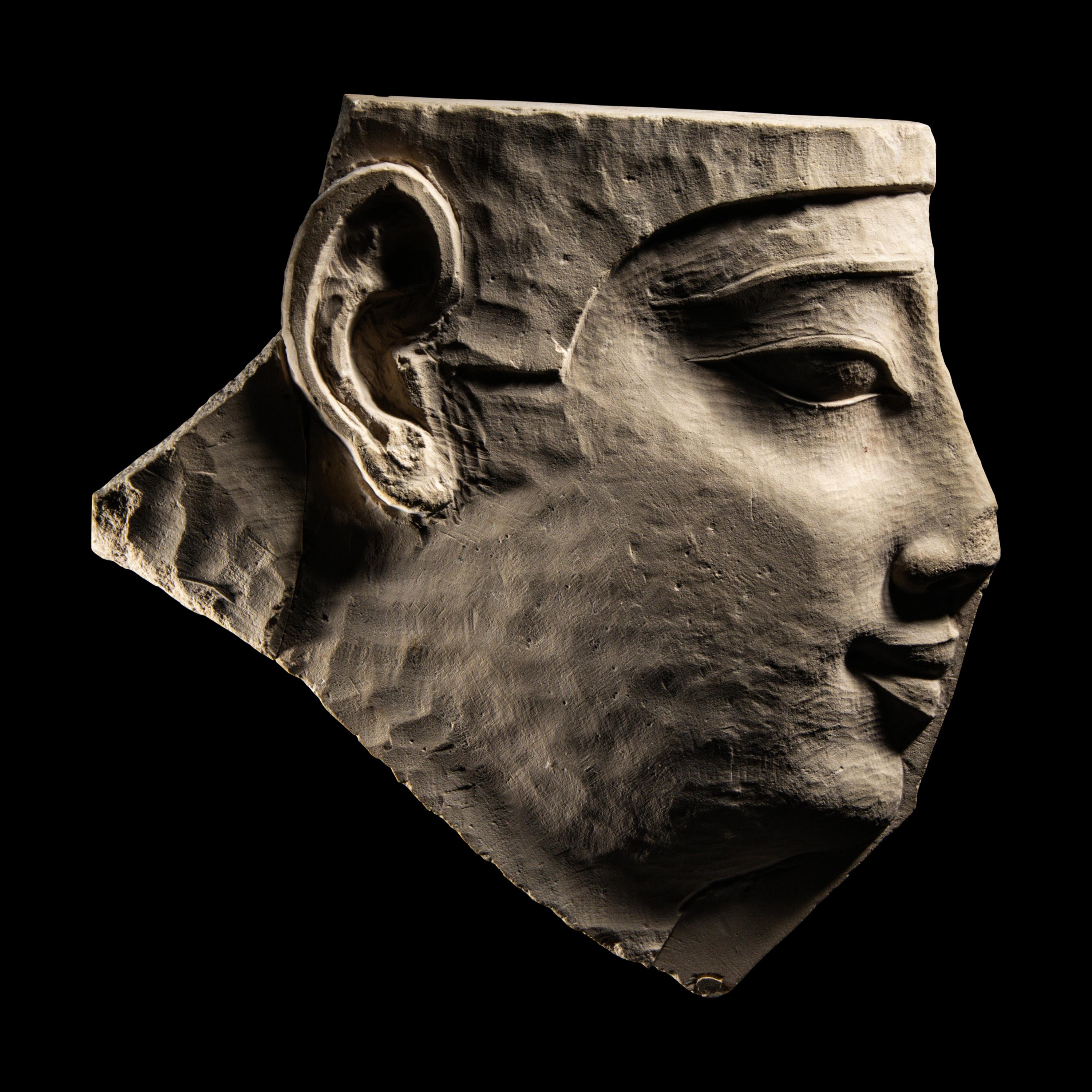 An Egyptian Limestone Sculptor's Model Fragment