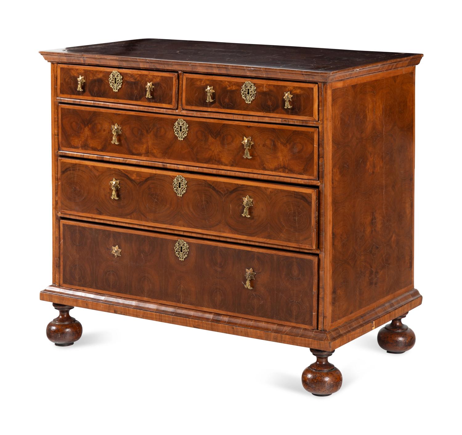 A William and Mary Oyster Walnut Chest of Drawers