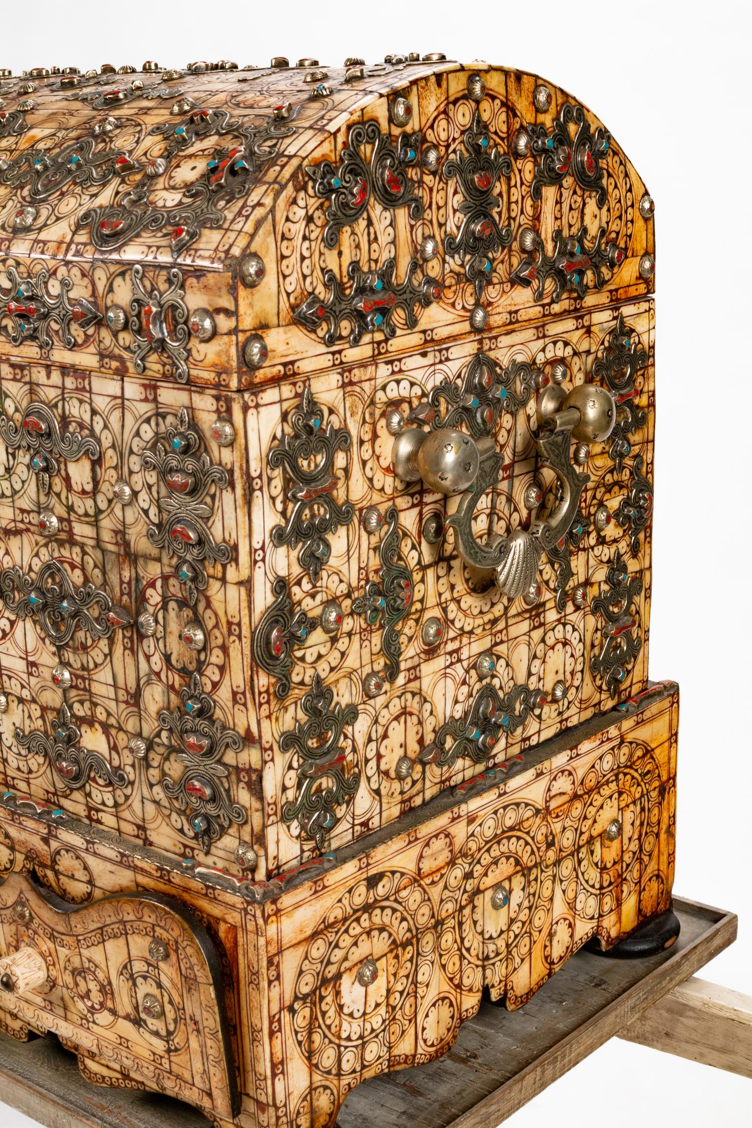 A 'Jeweled' Bone Casket on a Palanquin Supported by Gilt-Bronze Mongolian Attendants