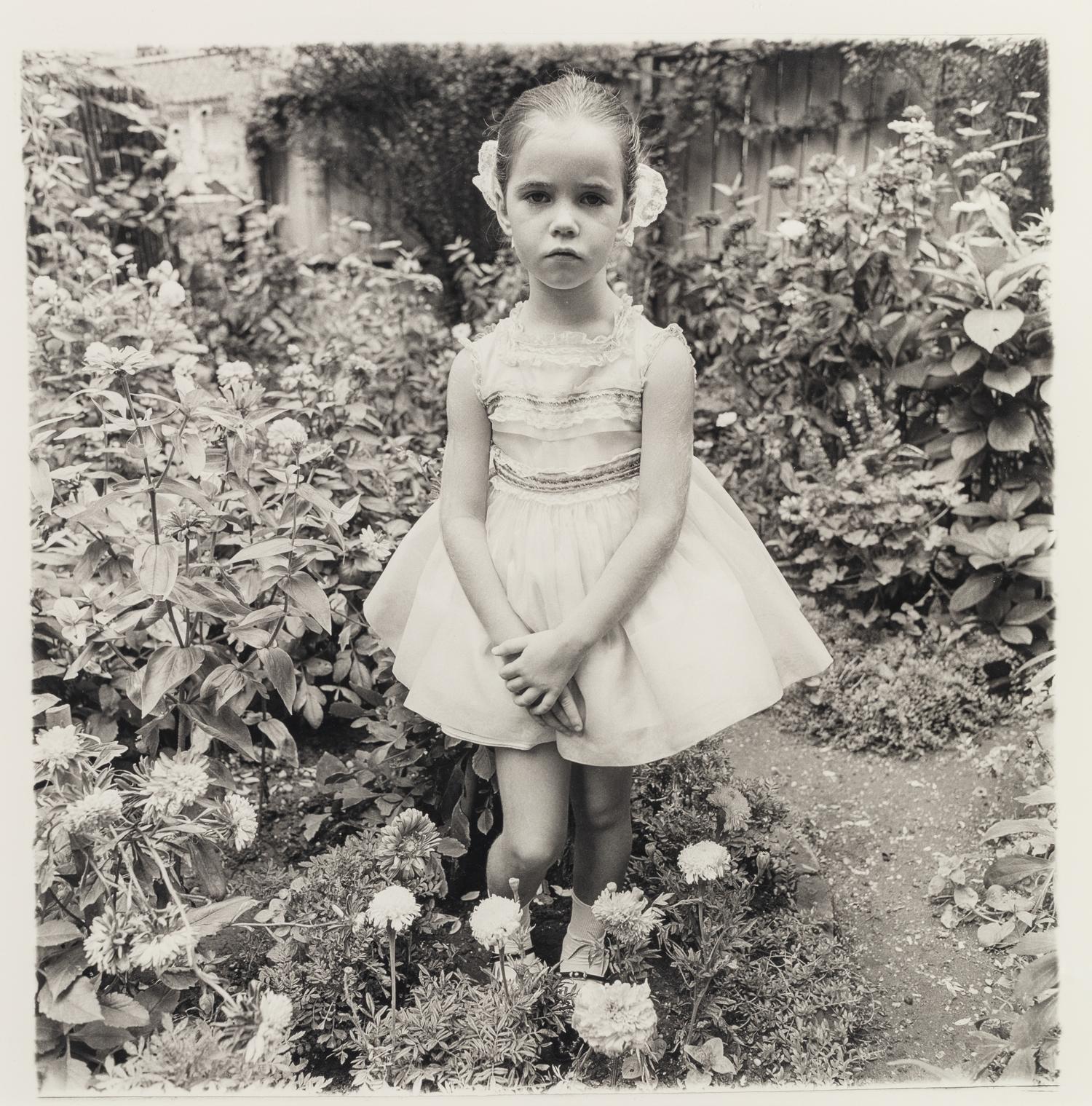 Diane Arbus (1923-1971) Girl in a party dress, NYC, 1967