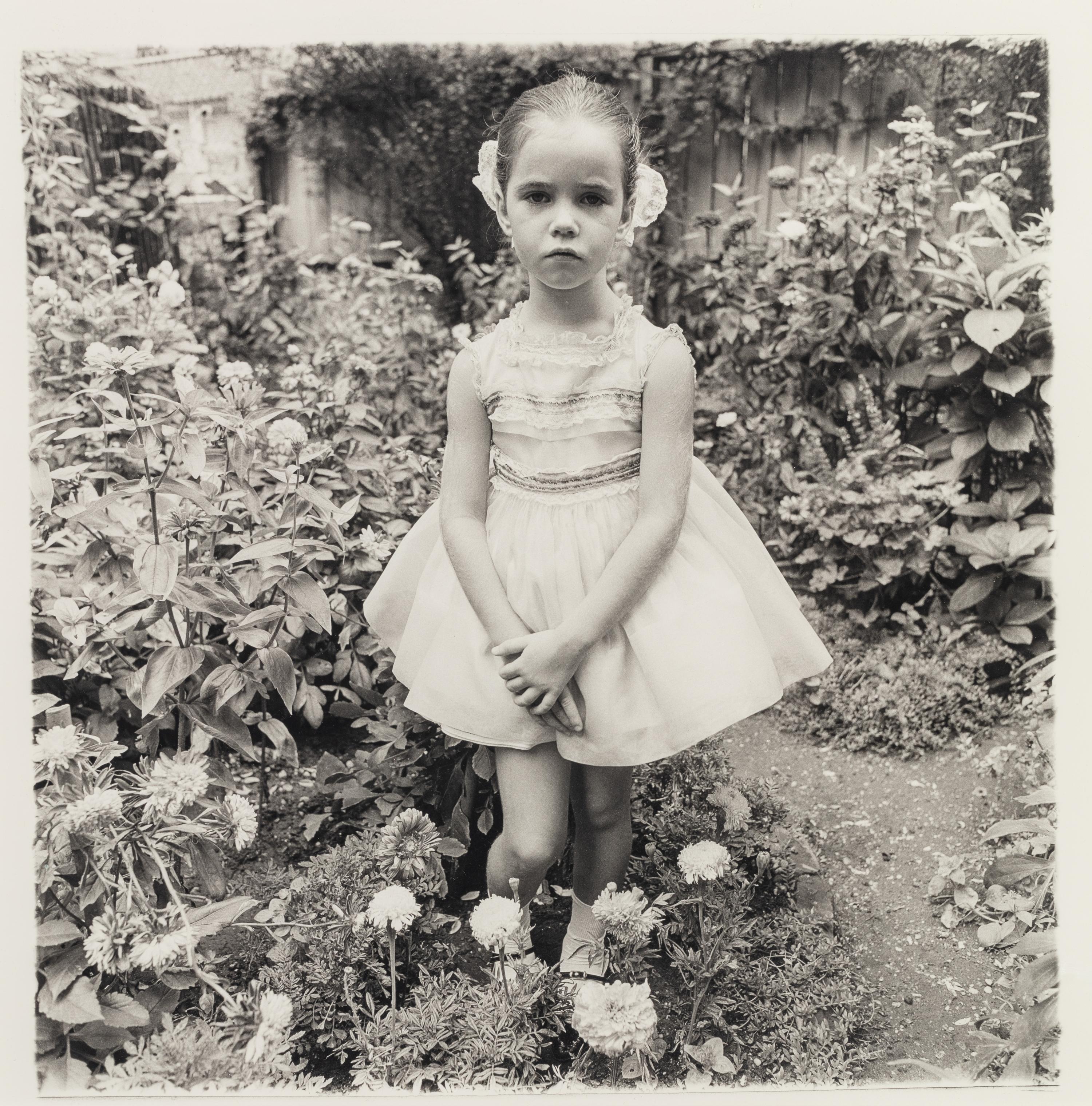 Diane Arbus (1923-1971) Girl in a party dress, NYC, 1967