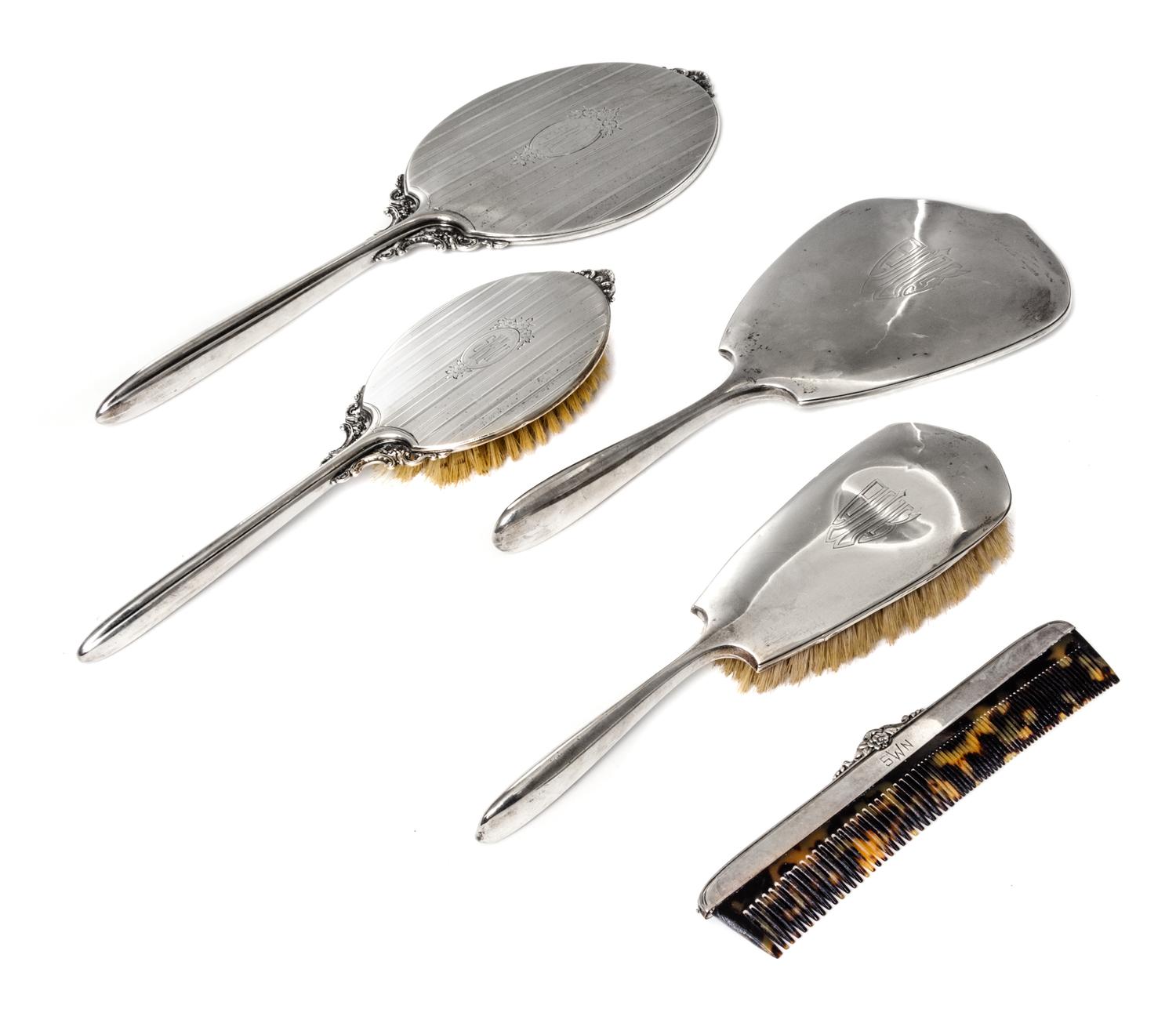 Five American Silver Mounted Dresser Articles, Various Makers, comprising two brushes, two hand mirrors and a comb with varying decorat