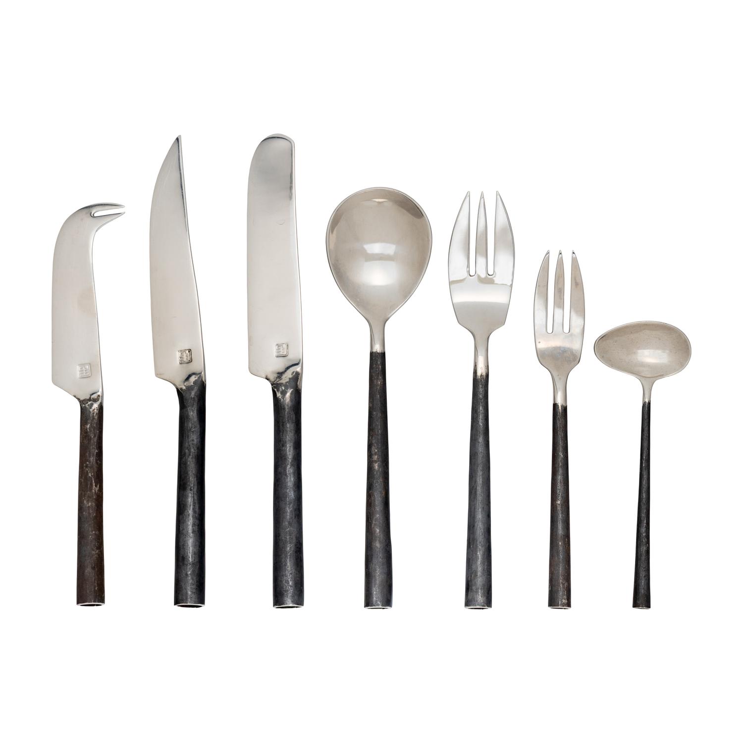 A Modernist Rolled Steel Flatware Service