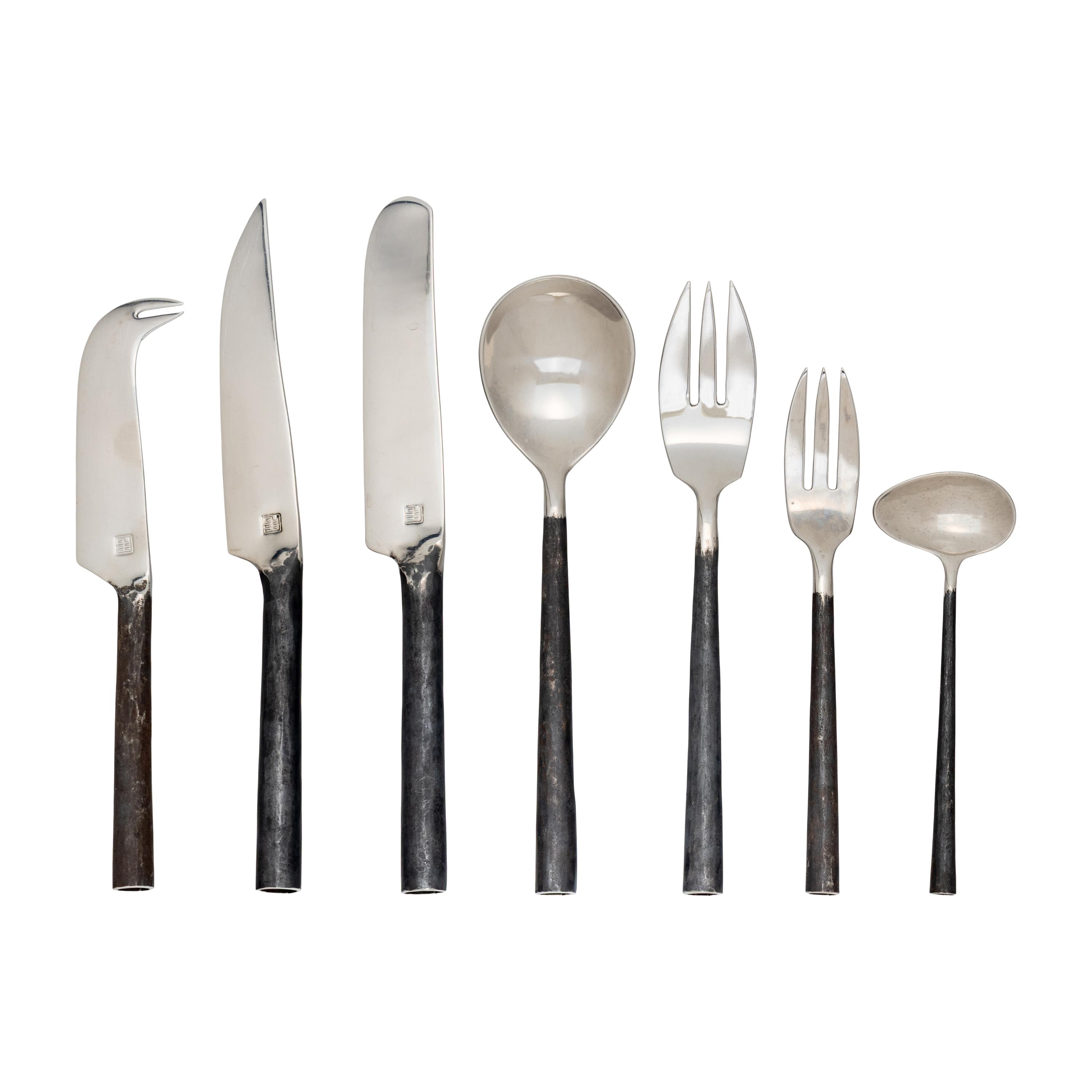 A Modernist Rolled Steel Flatware Service
