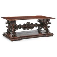 An Italian Renaissance Revival Carved Walnut Library Table