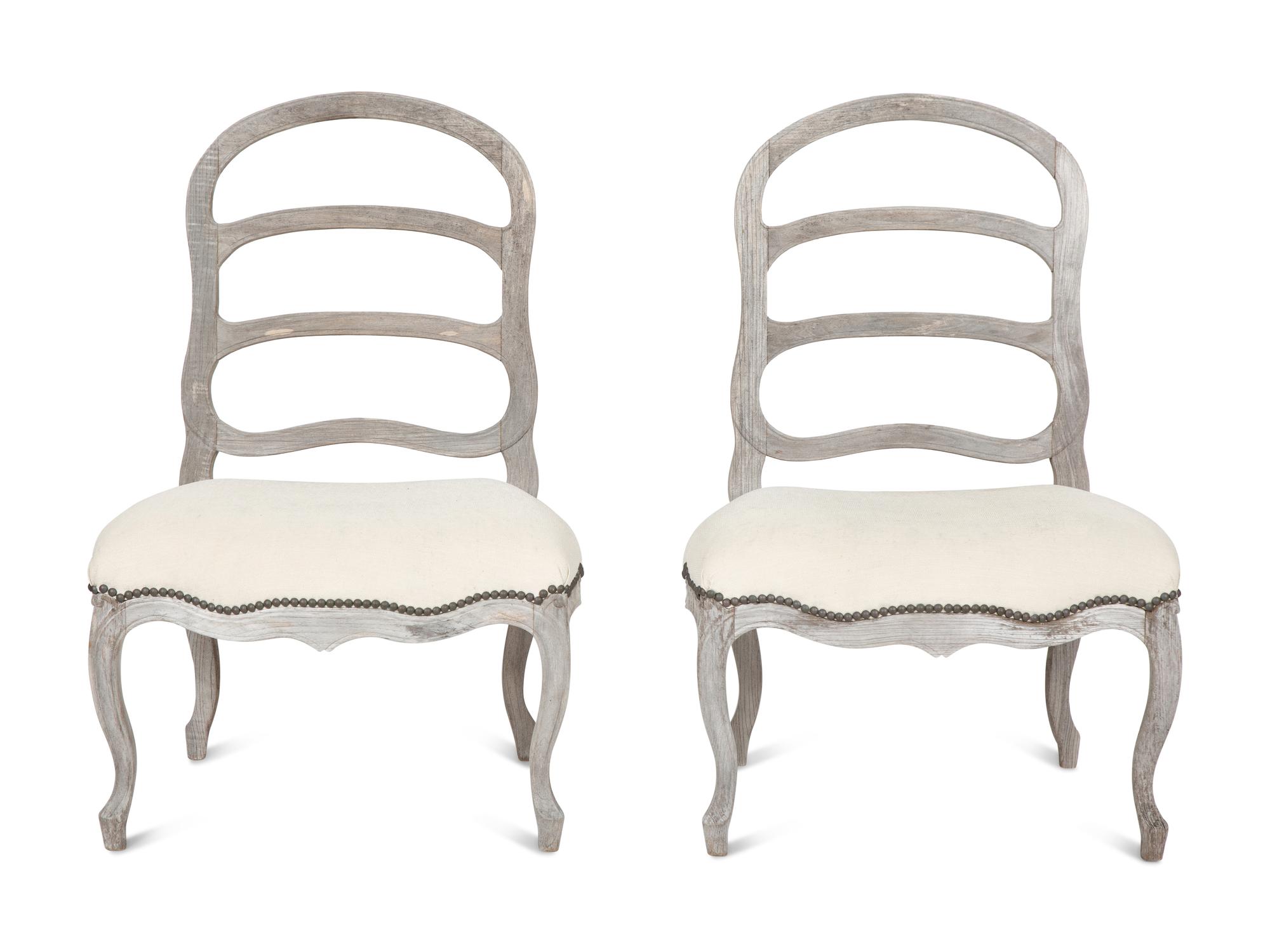 A Pair of Sutherland French Provincial Style Distressed Teak Side Chairs