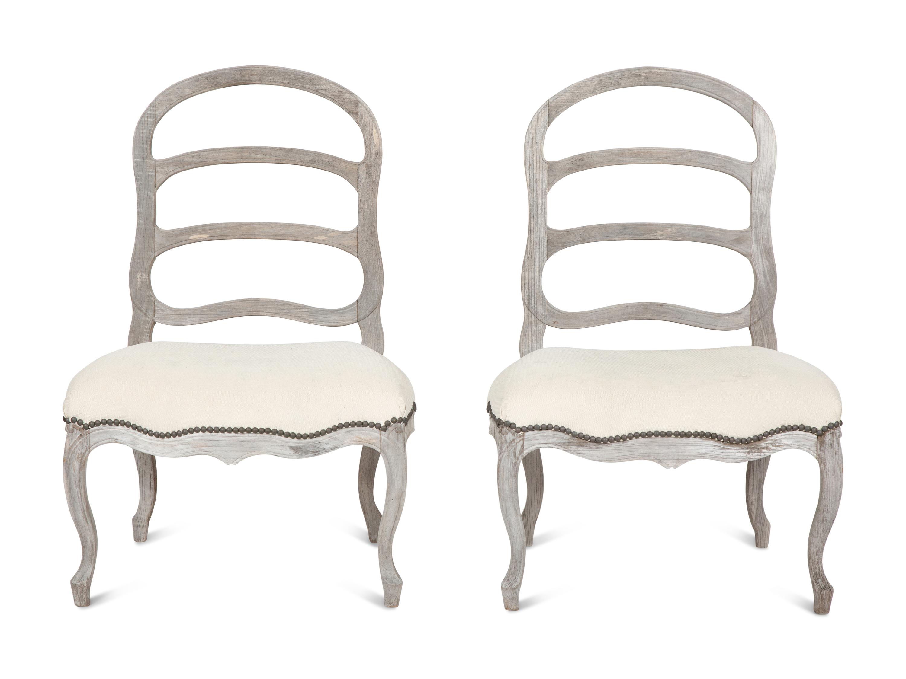 A Pair of Sutherland French Provincial Style Distressed Teak Side Chairs