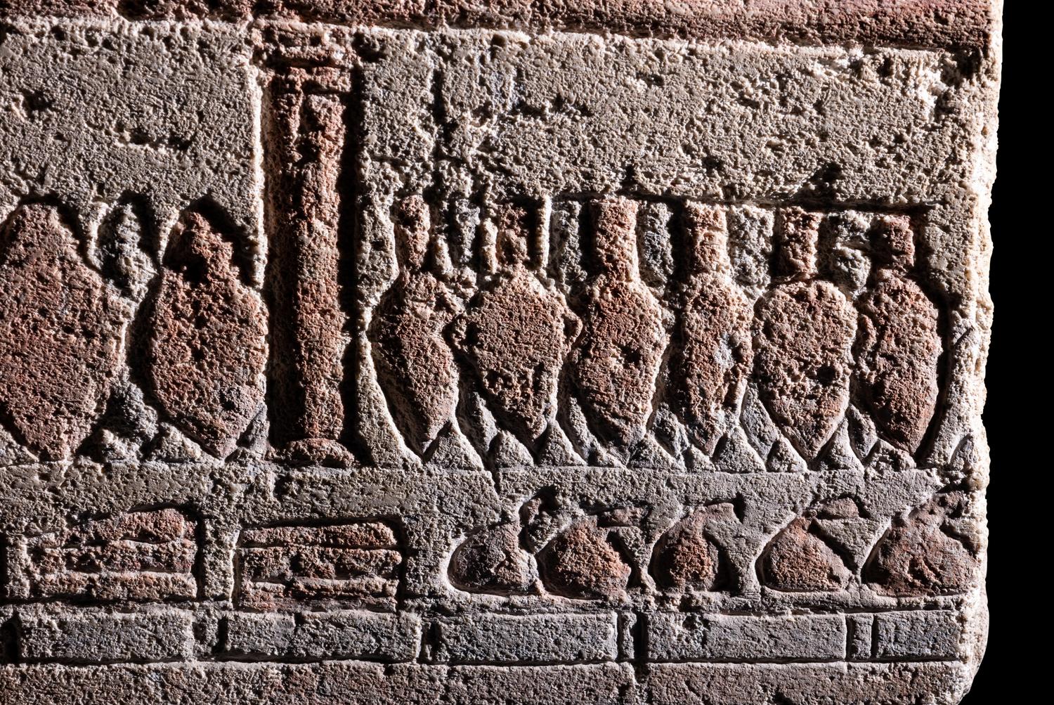 An Egyptian Polychrome Relief with Offering to the Aten