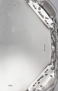 An American Silver Basket, Howard & Co., New York, NY, having a scrolling foliate open bowl with an octagonal bottom, raised on four sh