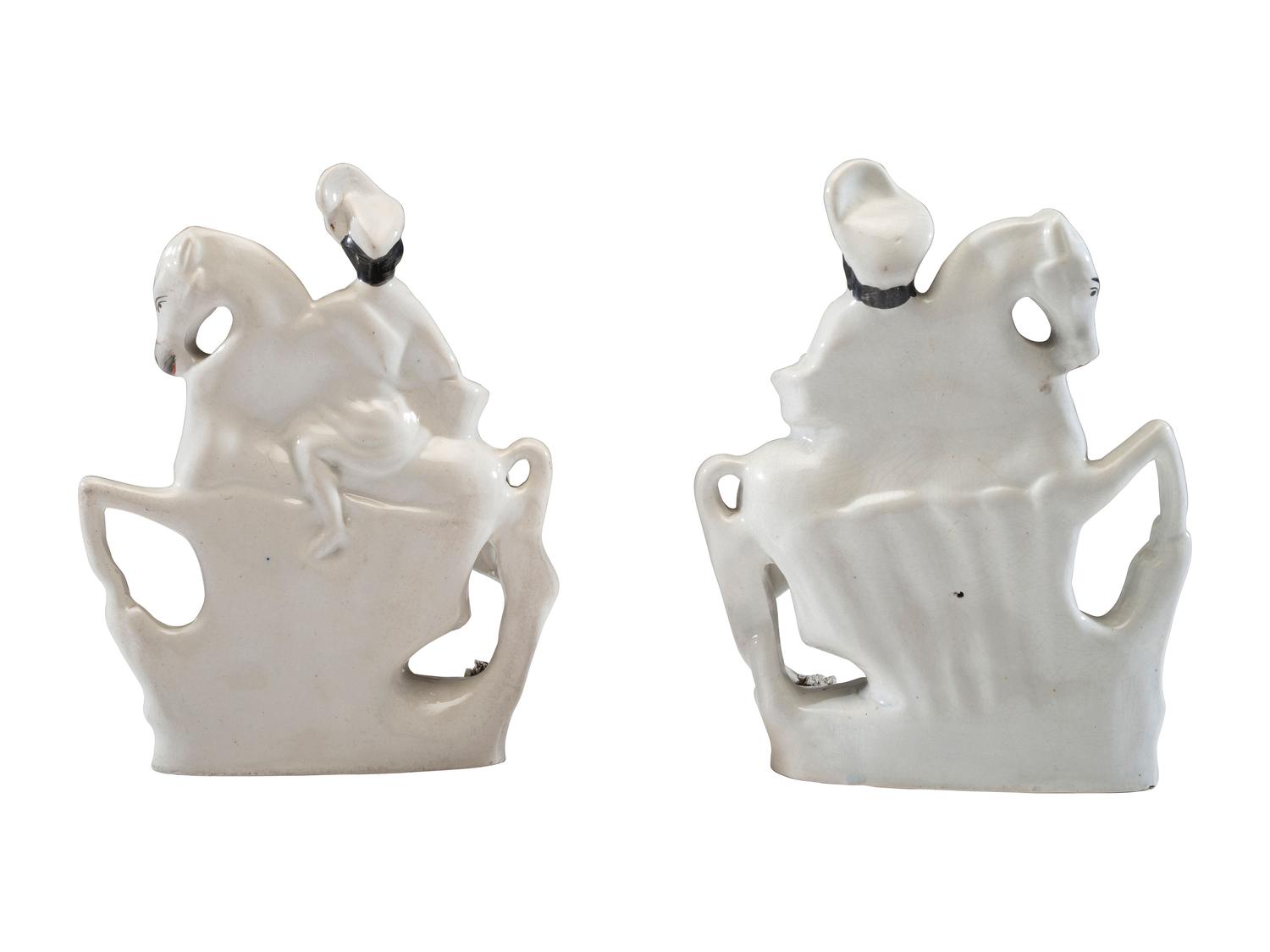 A Pair of Staffordshire Equestrian Figures