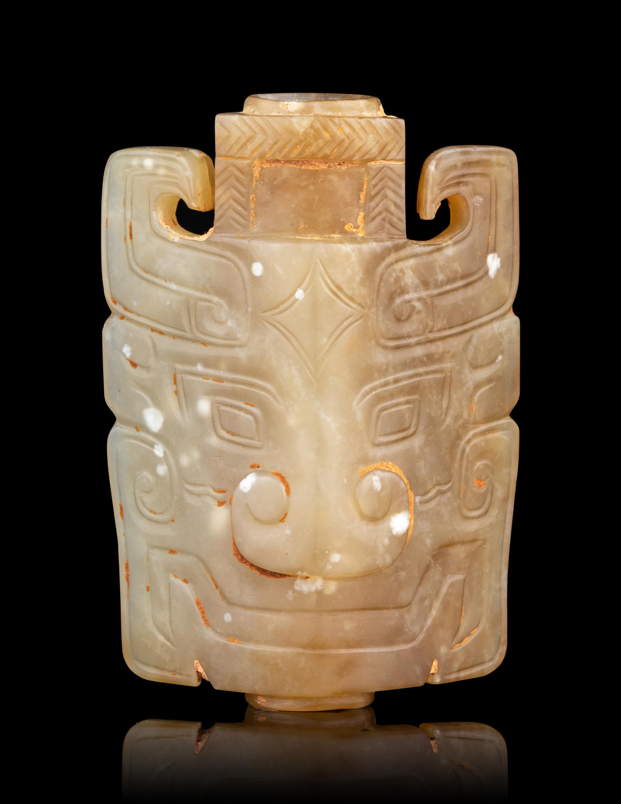 A Small Archaistic Jade Mask-Form Ornament