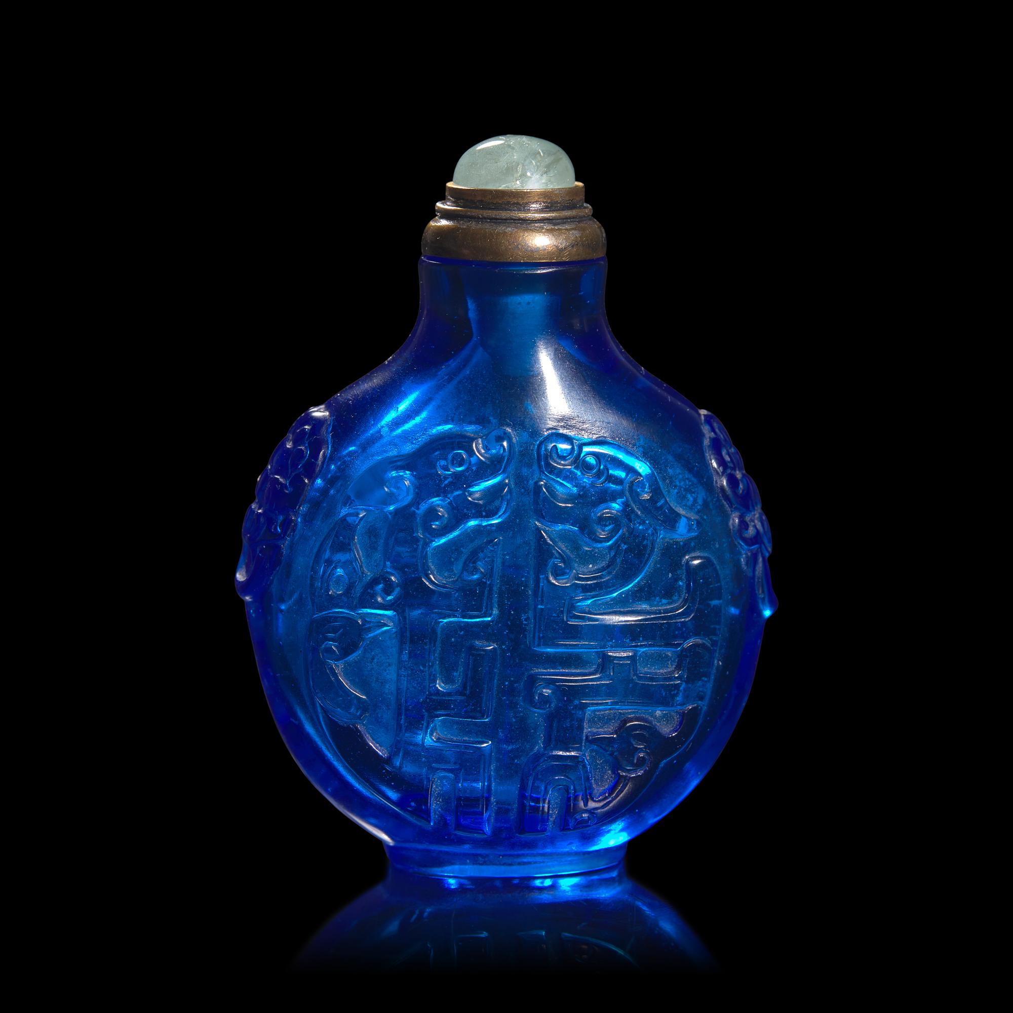 A Chinese Carved Sapphire Blue Glass "Archaistic Scrolls" Snuff Bottle