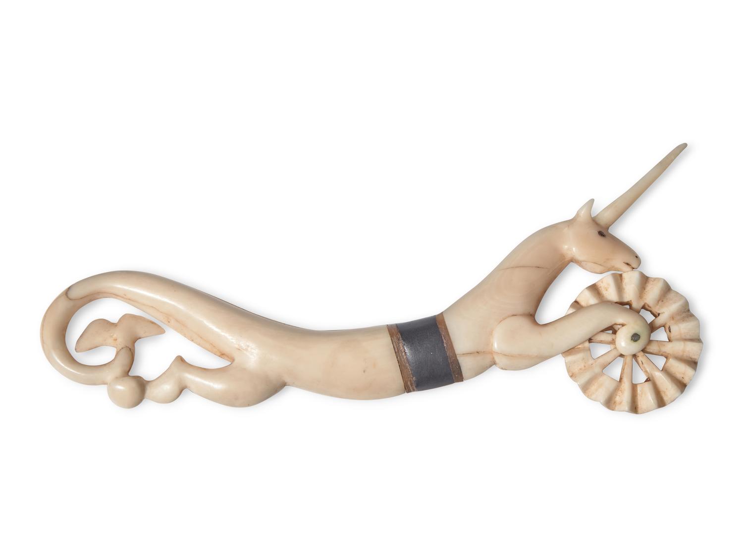 A Scrimshaw Carved Whale's Tooth Hippocampus-Form Pie Crimper, 19th Century