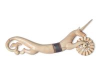 A Scrimshaw Carved Whale's Tooth Hippocampus-Form Pie Crimper, 19th Century