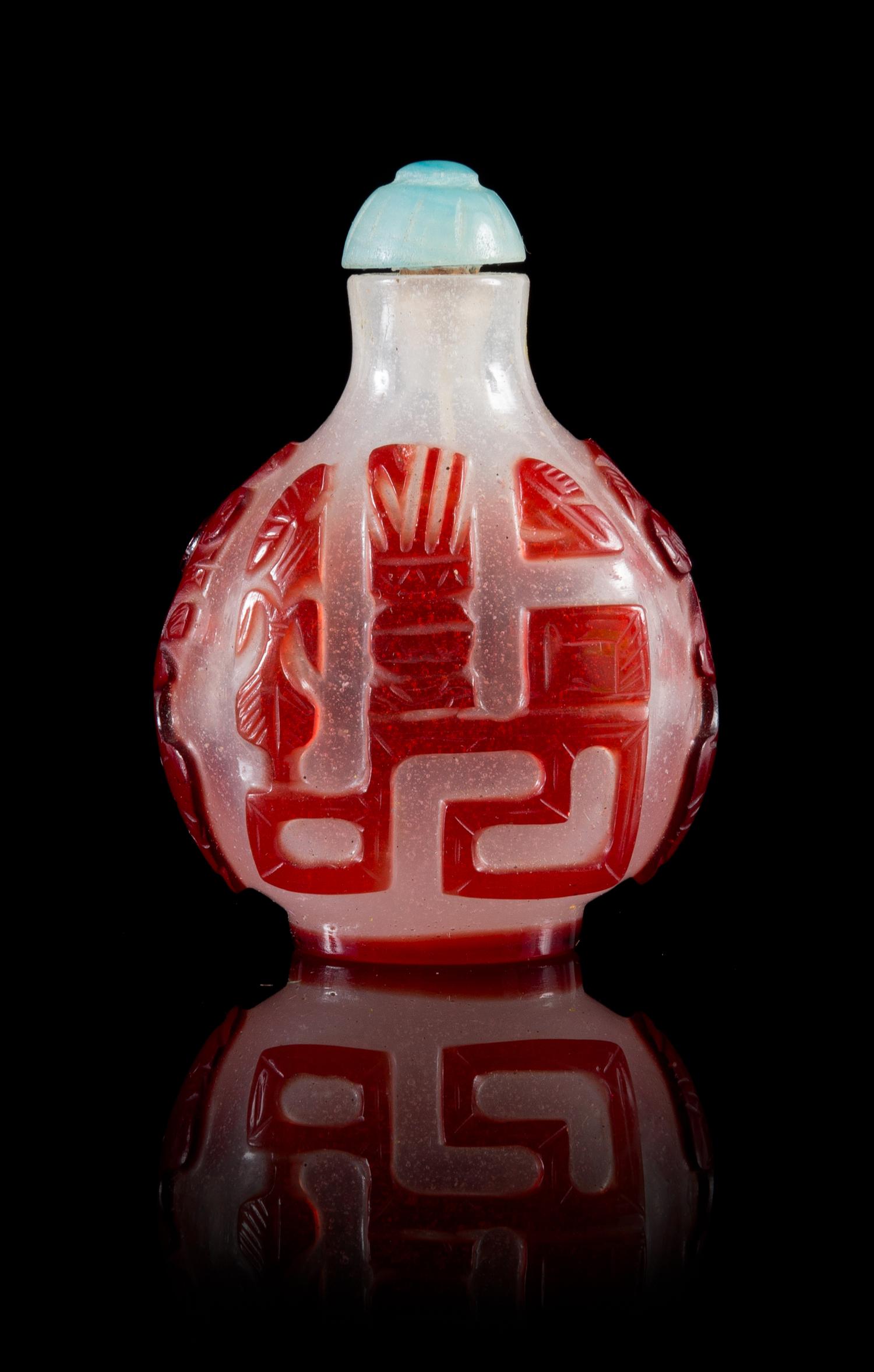 A Ruby Red Overlay Snowflake Ground Snuff Bottle Height 2 3/4 inches.