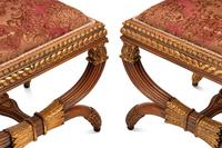 A Pair of Continental Parcel Gilt Walnut Stools