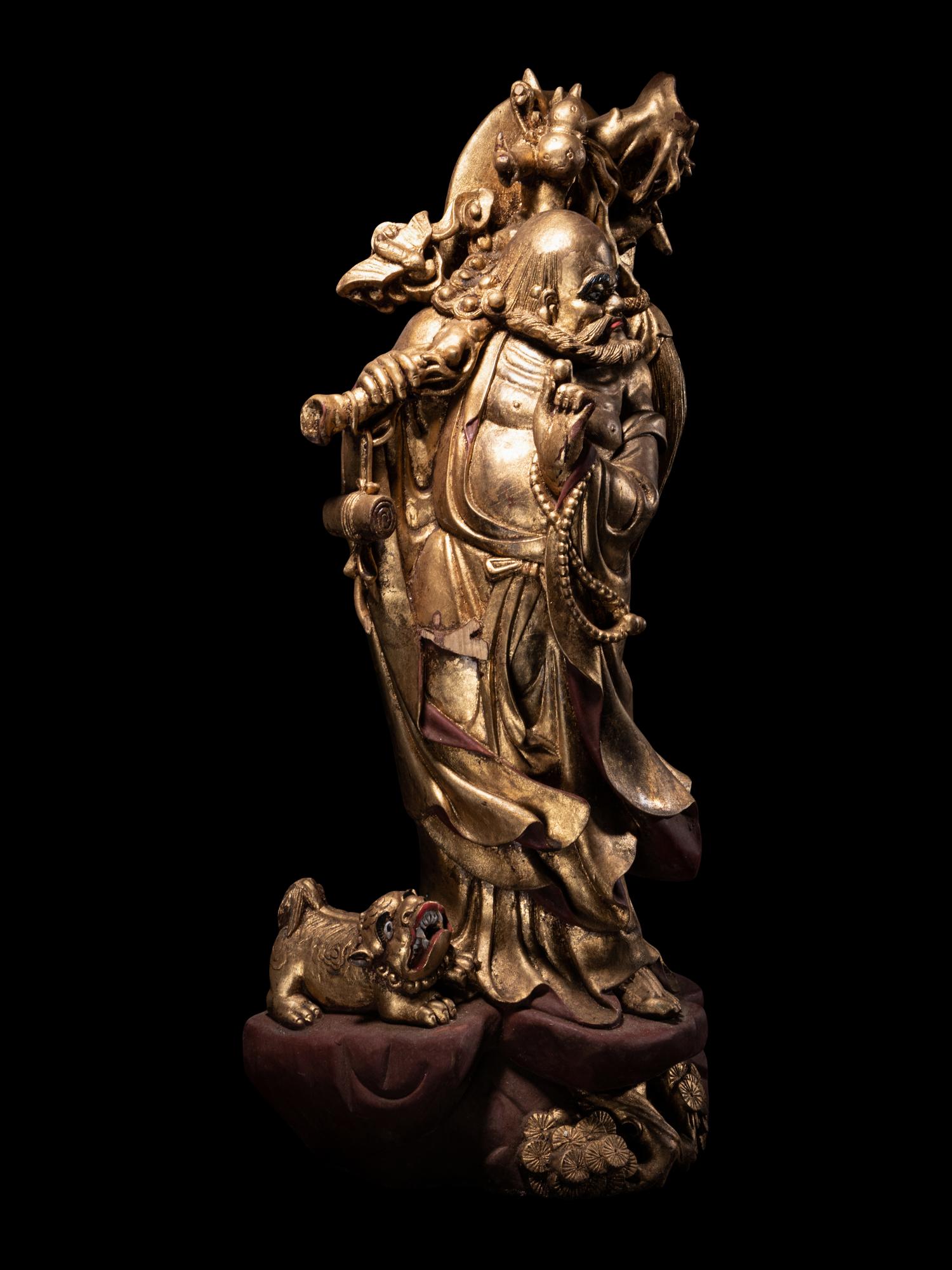 A Chinese Gilt Lacquered Wood Figure of Immortal