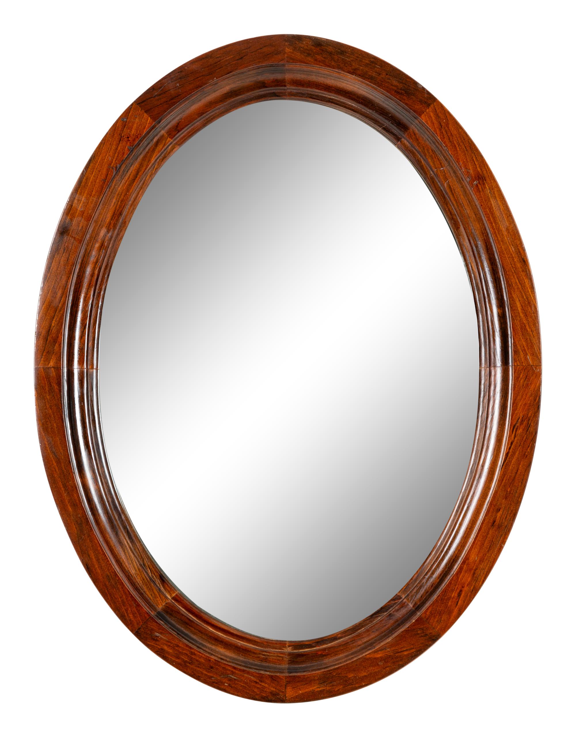 A Pair of Mahogany Oval Mirrors