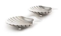 A Pair of American Silver Ash Receivers, Tiffany & Co., New York, NY, 1937, each of shell form with two feet.