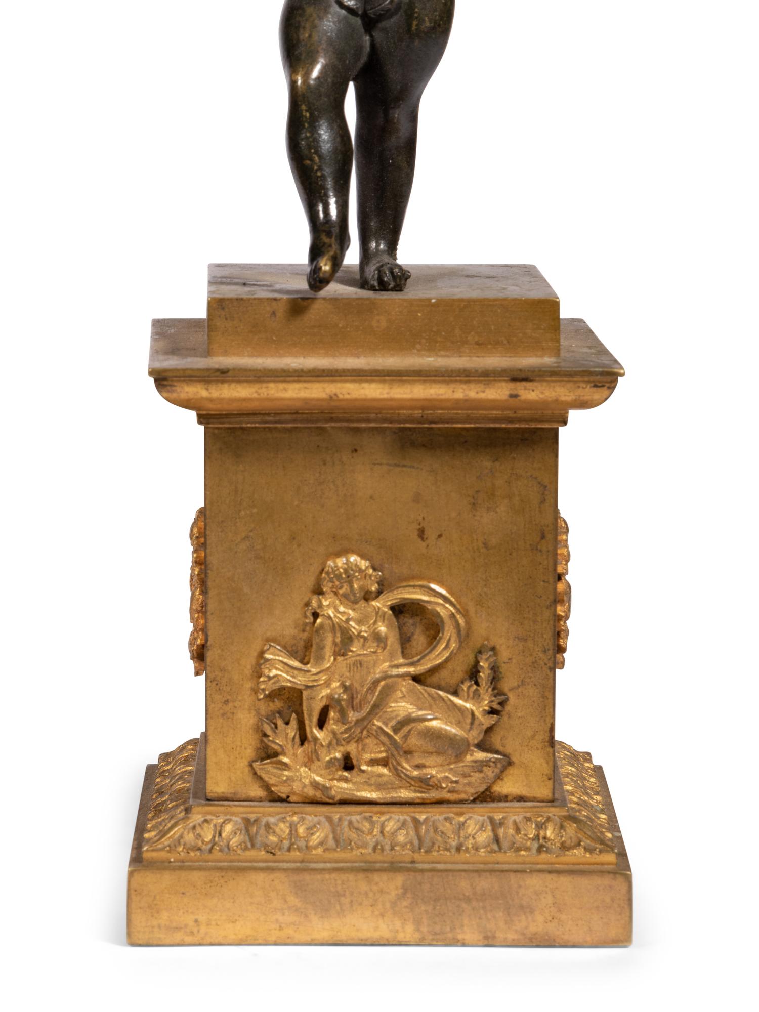 A Pair of Gilt and Patinated Bronze Figural Two-Light Candelabra