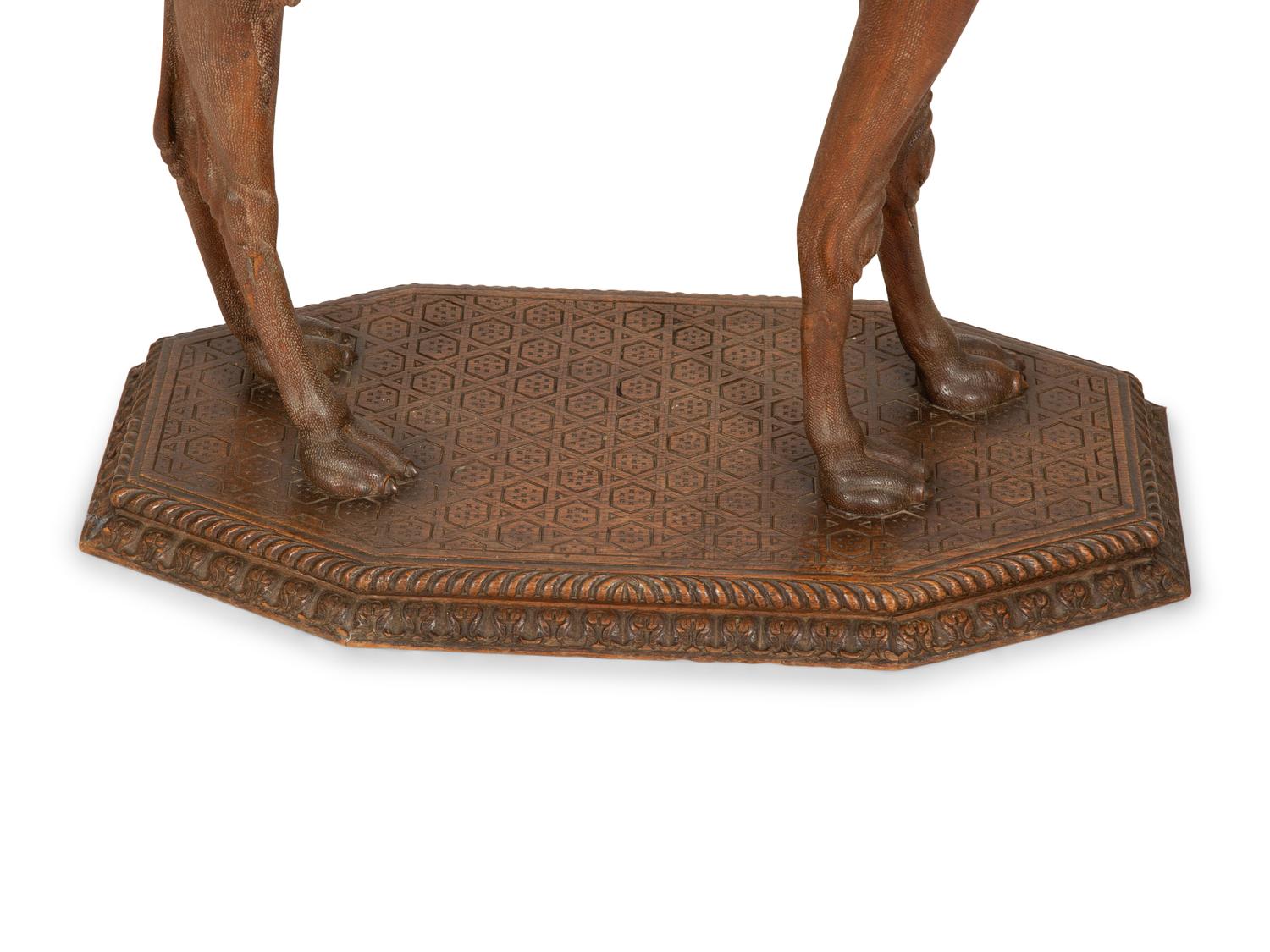 A Middle Eastern Carved Oak Camel-Form Side Table