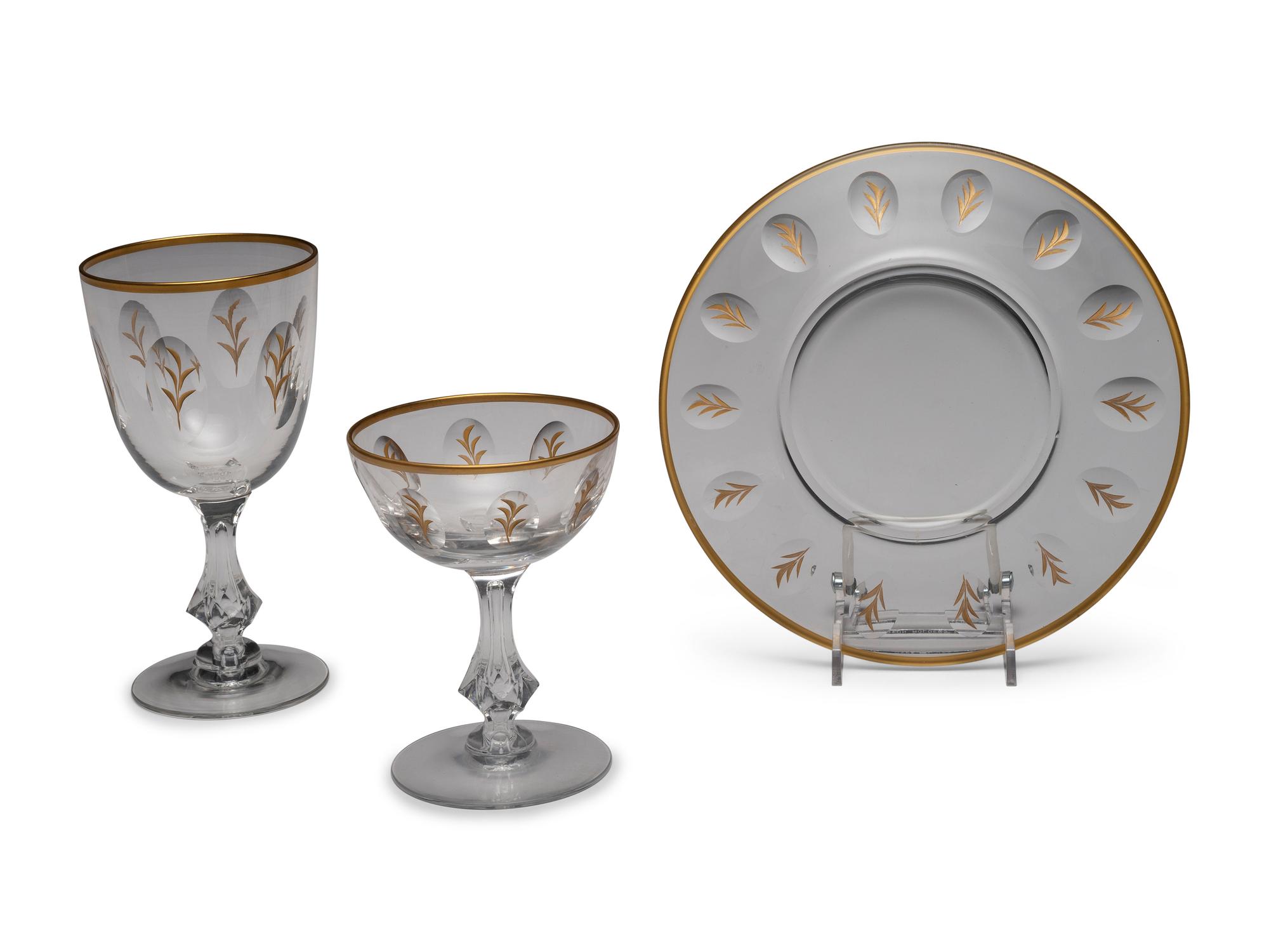 A Set of Tiffin Glass Company Gold and Glass Stemware and Plates