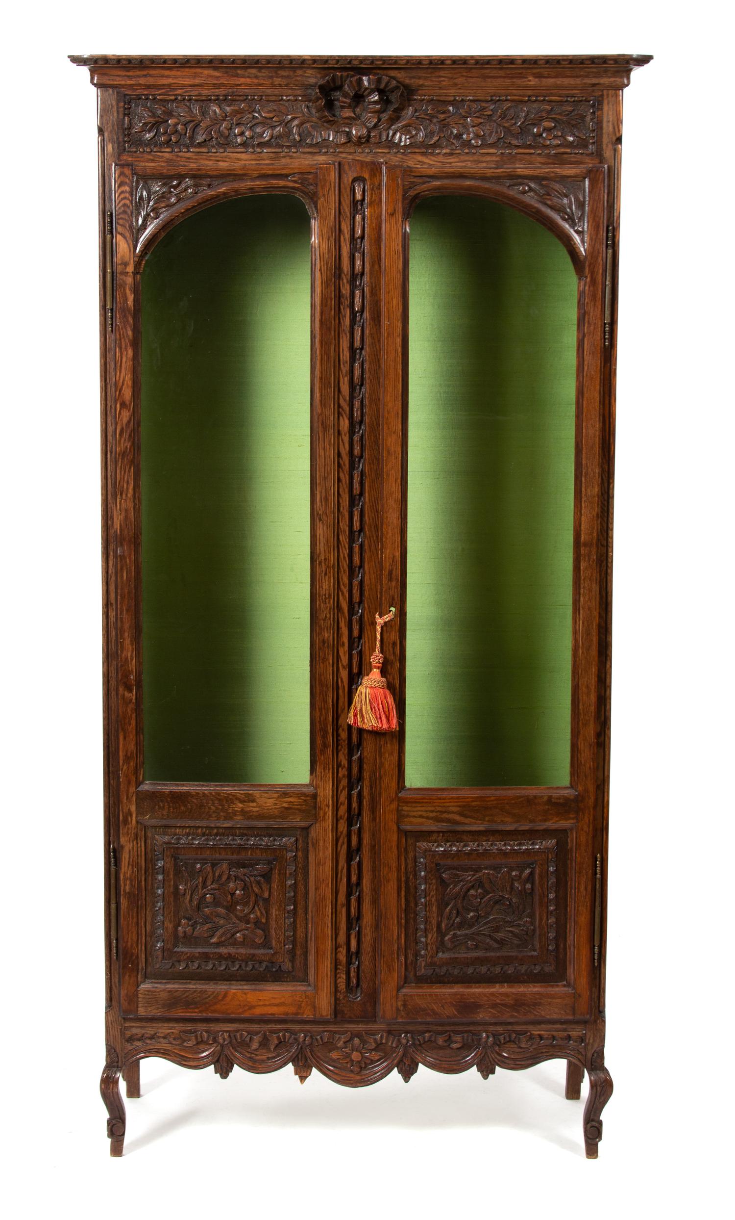 A French Provincial Style Carved Oak Display Cabinet Height 68 x width 34 1/2 x depth 13 inches. — 20TH CENTURY