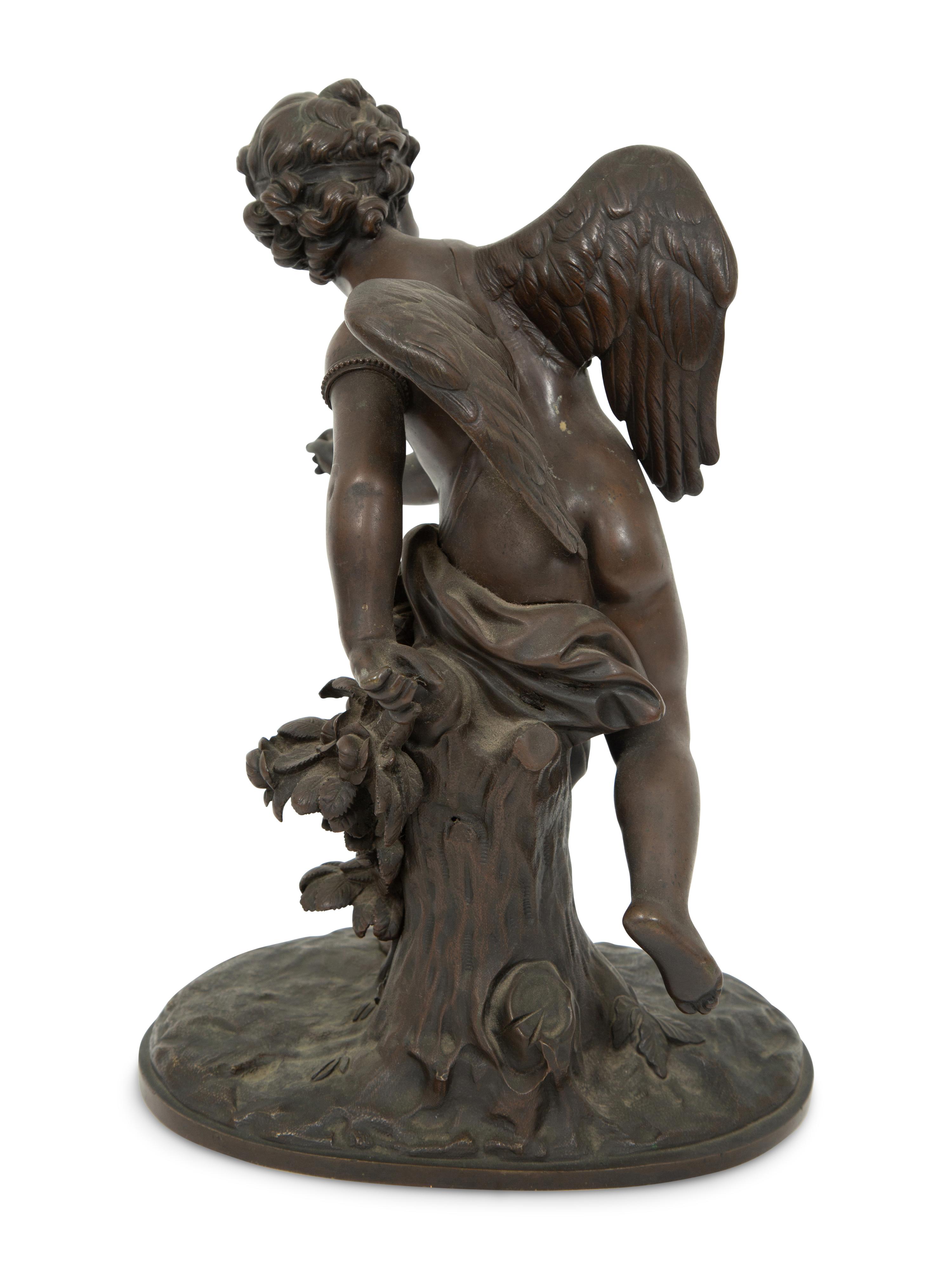 A French Bronze Figure of Eros on a Wood Base