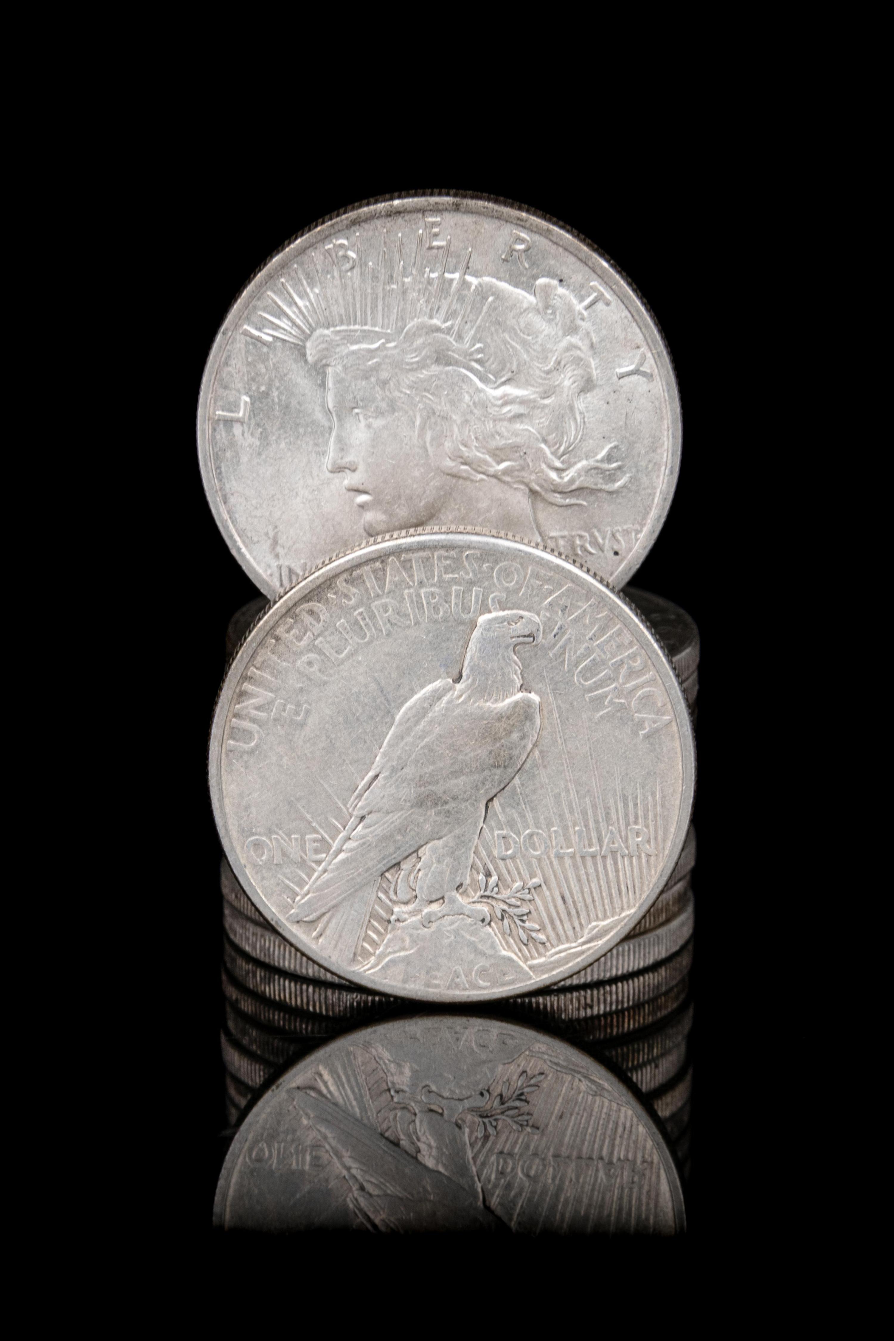 A Group of Eleven Peace $1 Coins