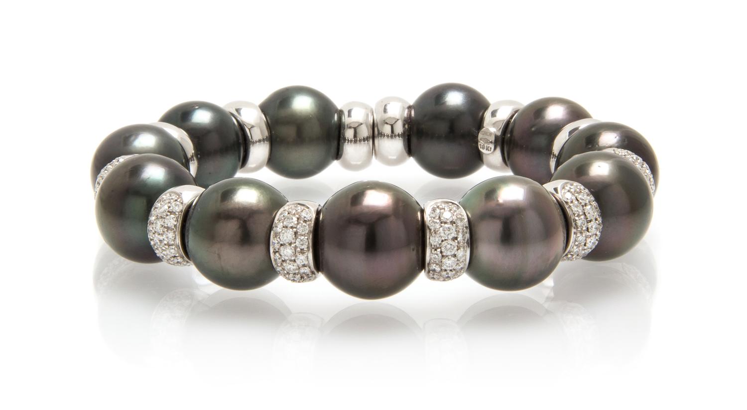 An 18 Karat White Gold, Diamond and Cultured South Sea Pearl Bracelet, Italian, 51.50 dwts.