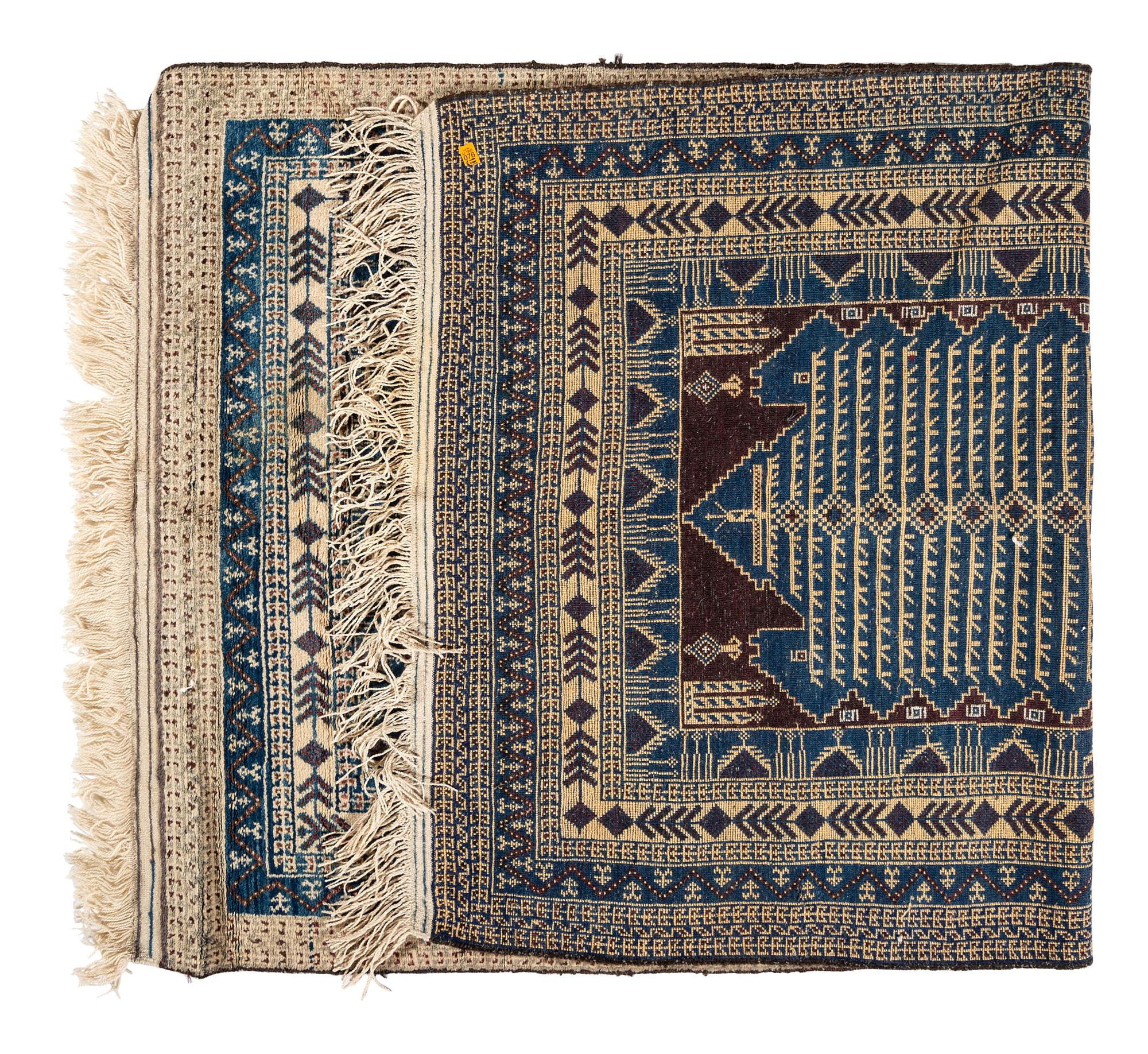 A Turkish or Afghan Wool Rug