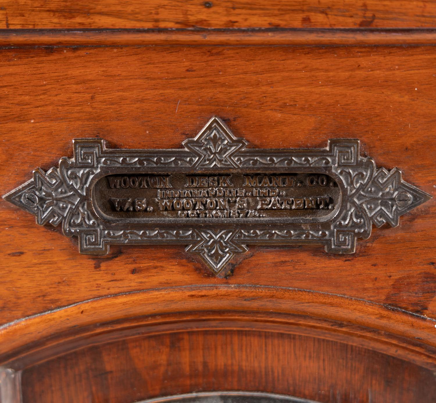 A Victorian Walnut and Bird’s Eye Maple Wooten Patent Desk