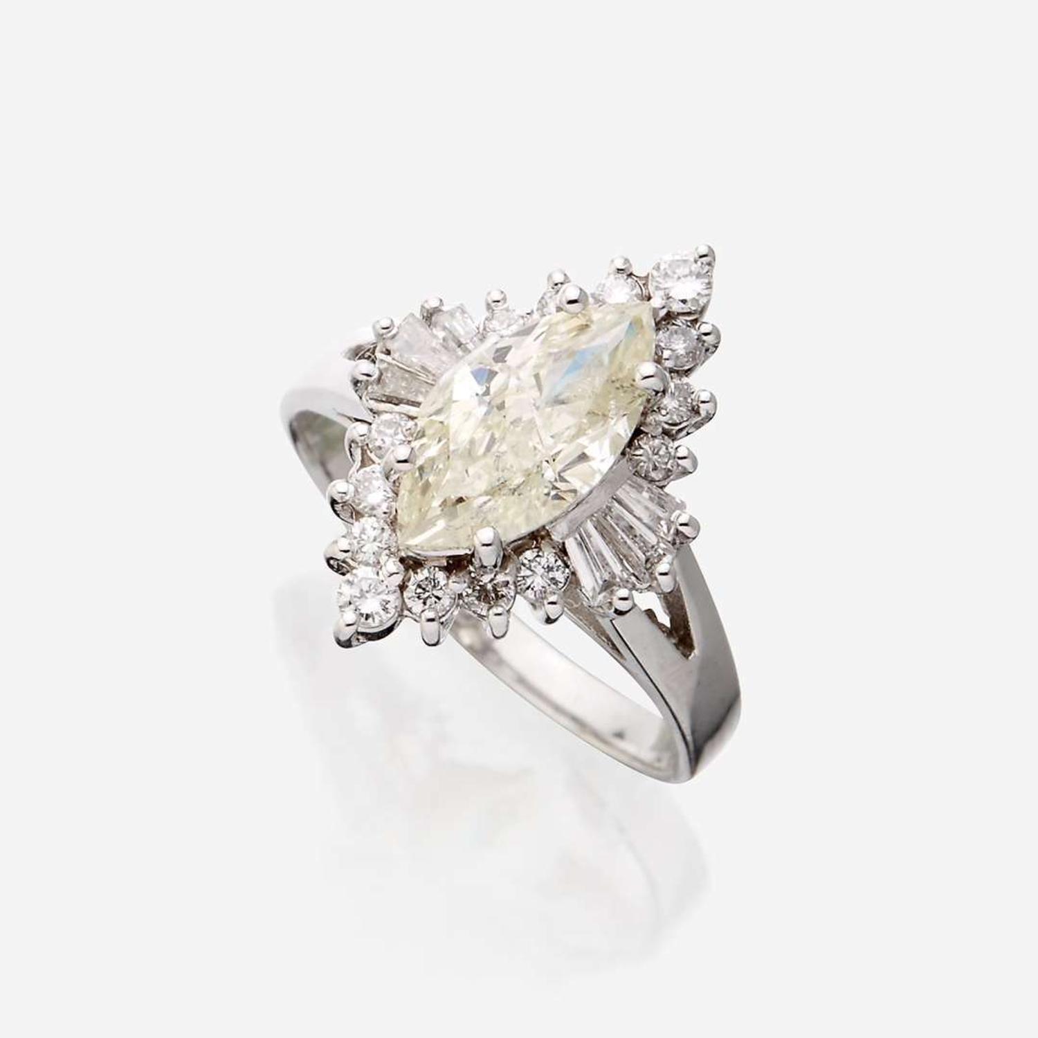 A diamond and eighteen karat white gold ring