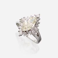 A diamond and eighteen karat white gold ring