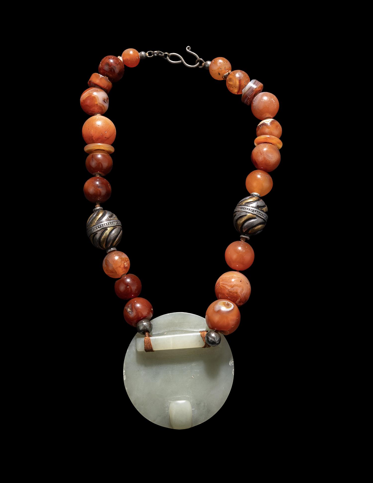 A Chinese Russet and Pale Celadon Jade Belt Buckle