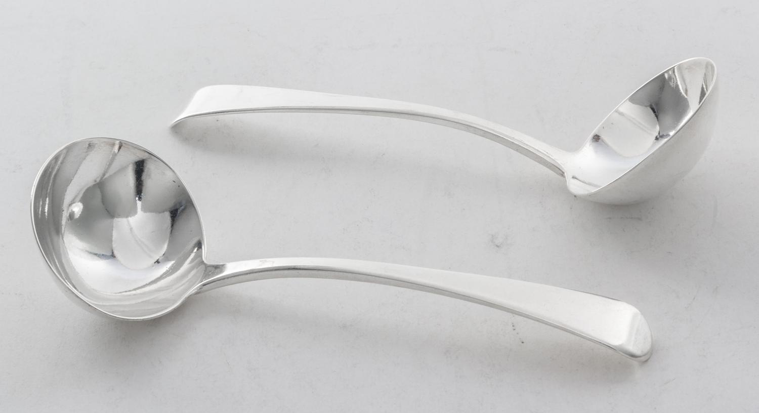 A Pair of English Silver Sauce Ladles, Richard Crossly, London, 1812, with rounded down-turned handles.
