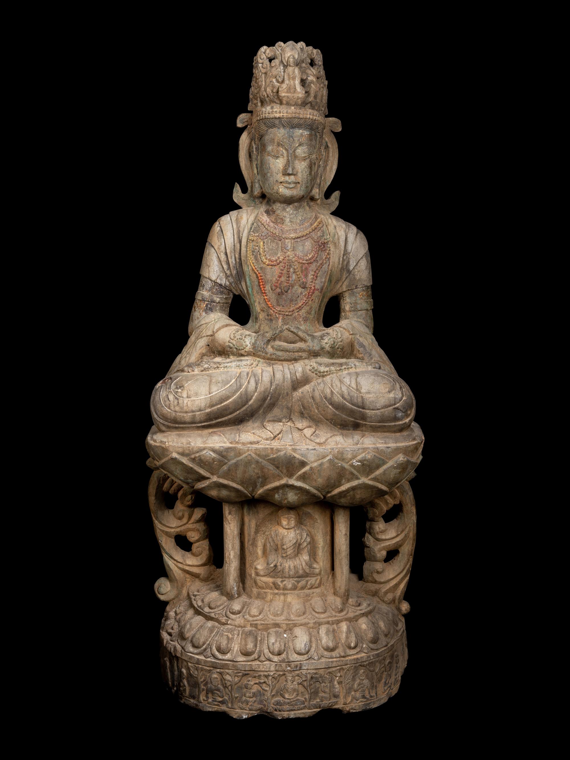 A Chinese Carved Stone Seated Guanyin Figure