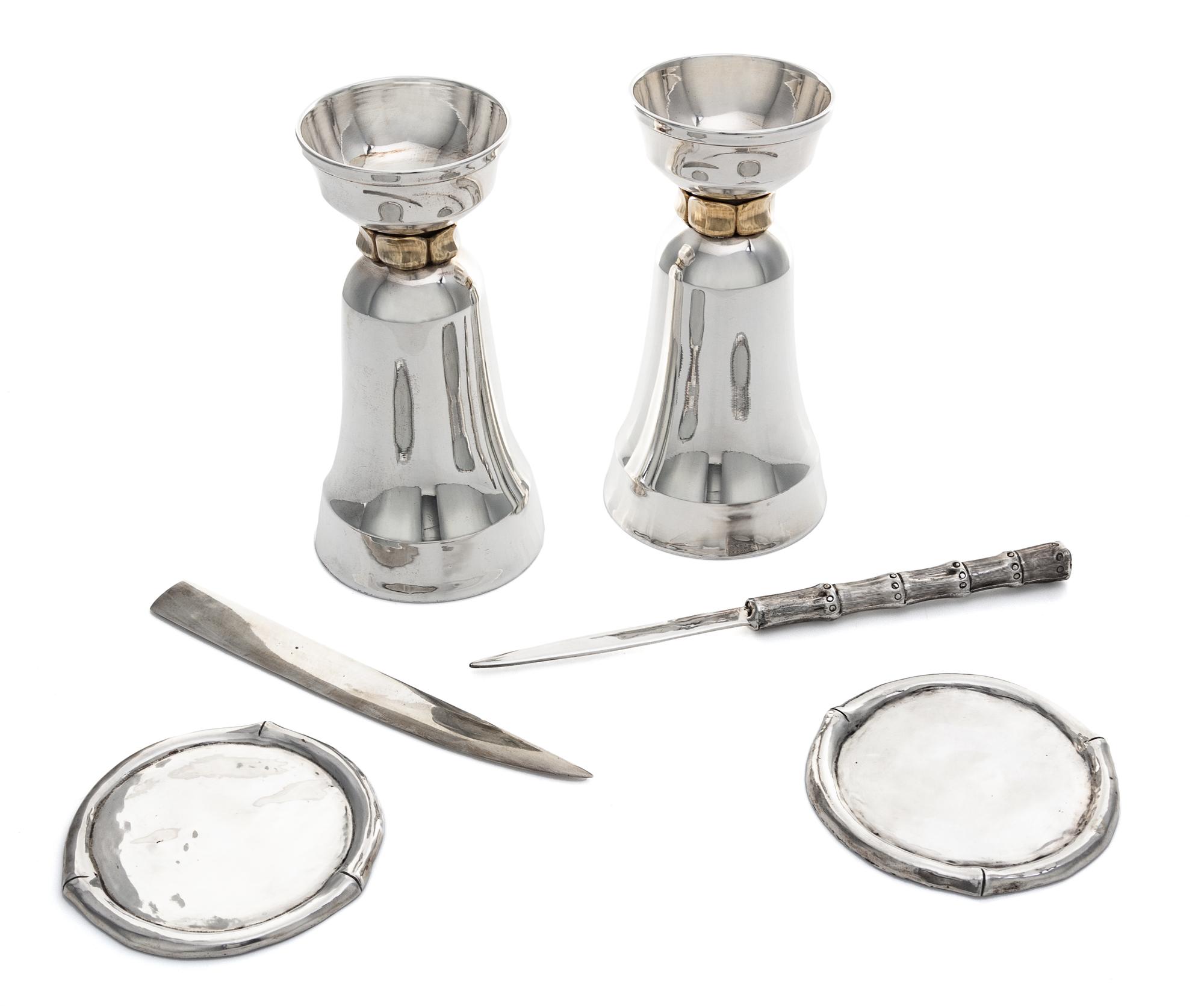 A Group of Six Silver Articles, Various makers, 20th Century, comprising a pair of candlesticks, two coasters and two letter openers.