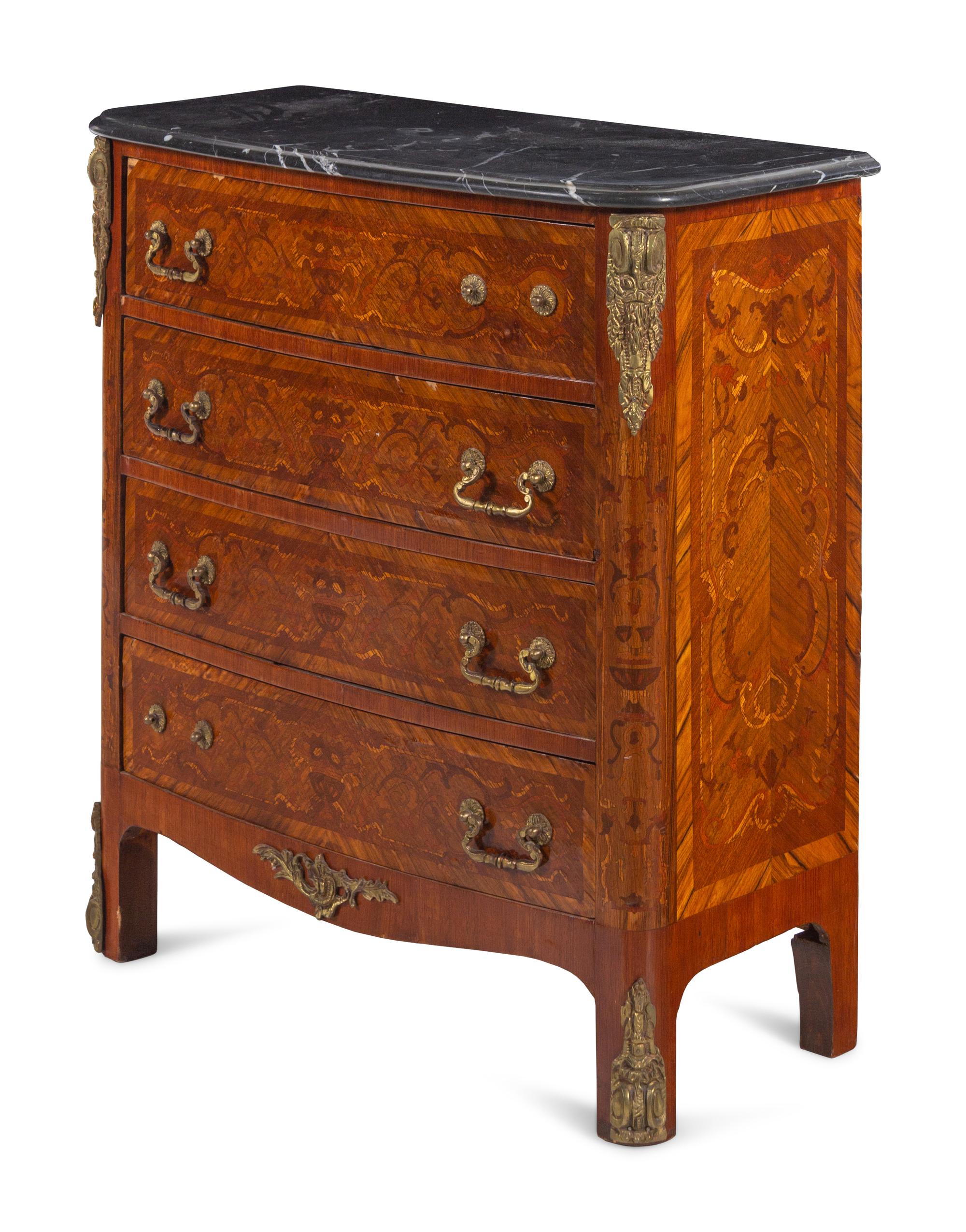 A Louis XV/XVI Transitional Style Gilt Bronze Mounted Marquetry Chest of Drawers