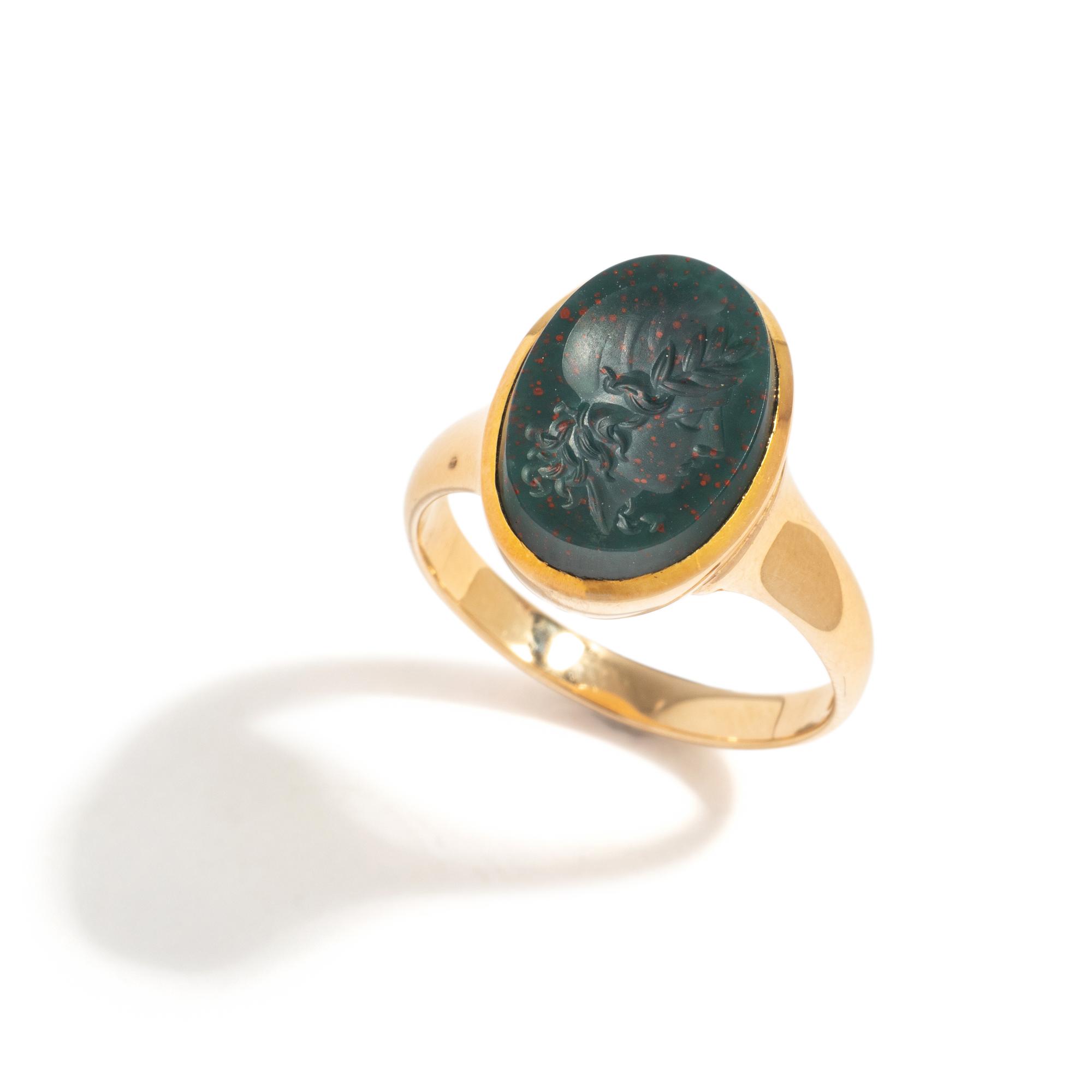 A Neoclassical Gold and Bloodstone Finger Ring with a Female Portrait Head Wearing a Phrygian Cap (Symbol of Liberty)