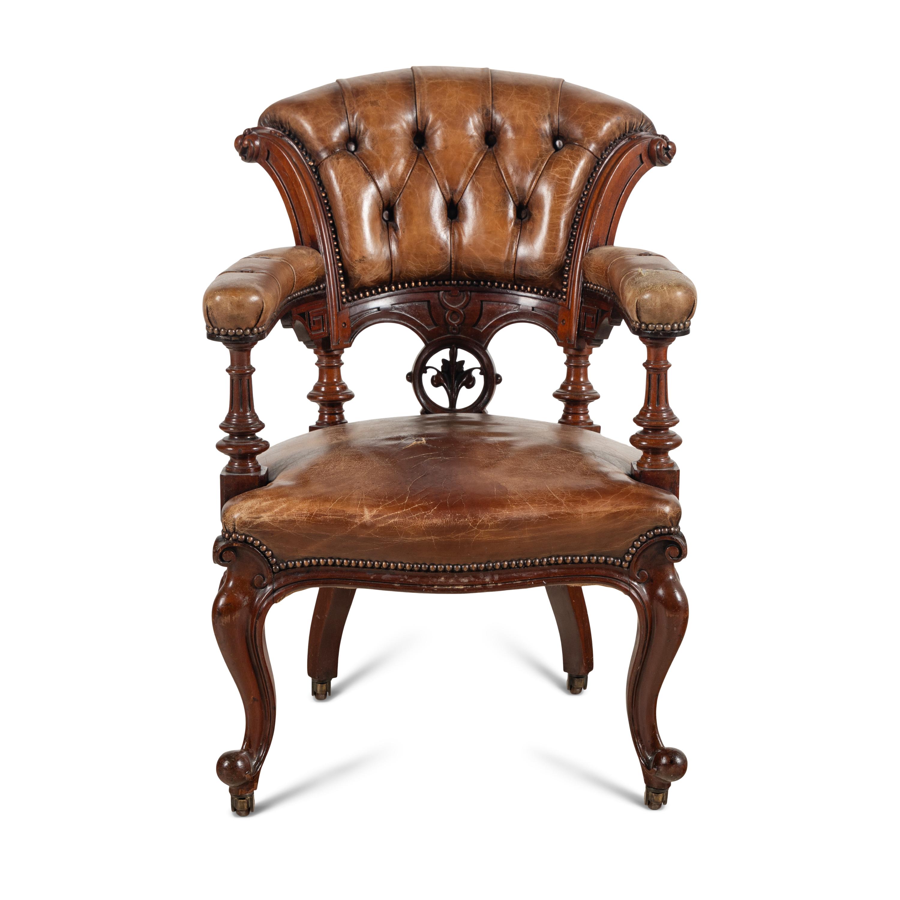 An English Walnut and Leather-Upholstered Armchair