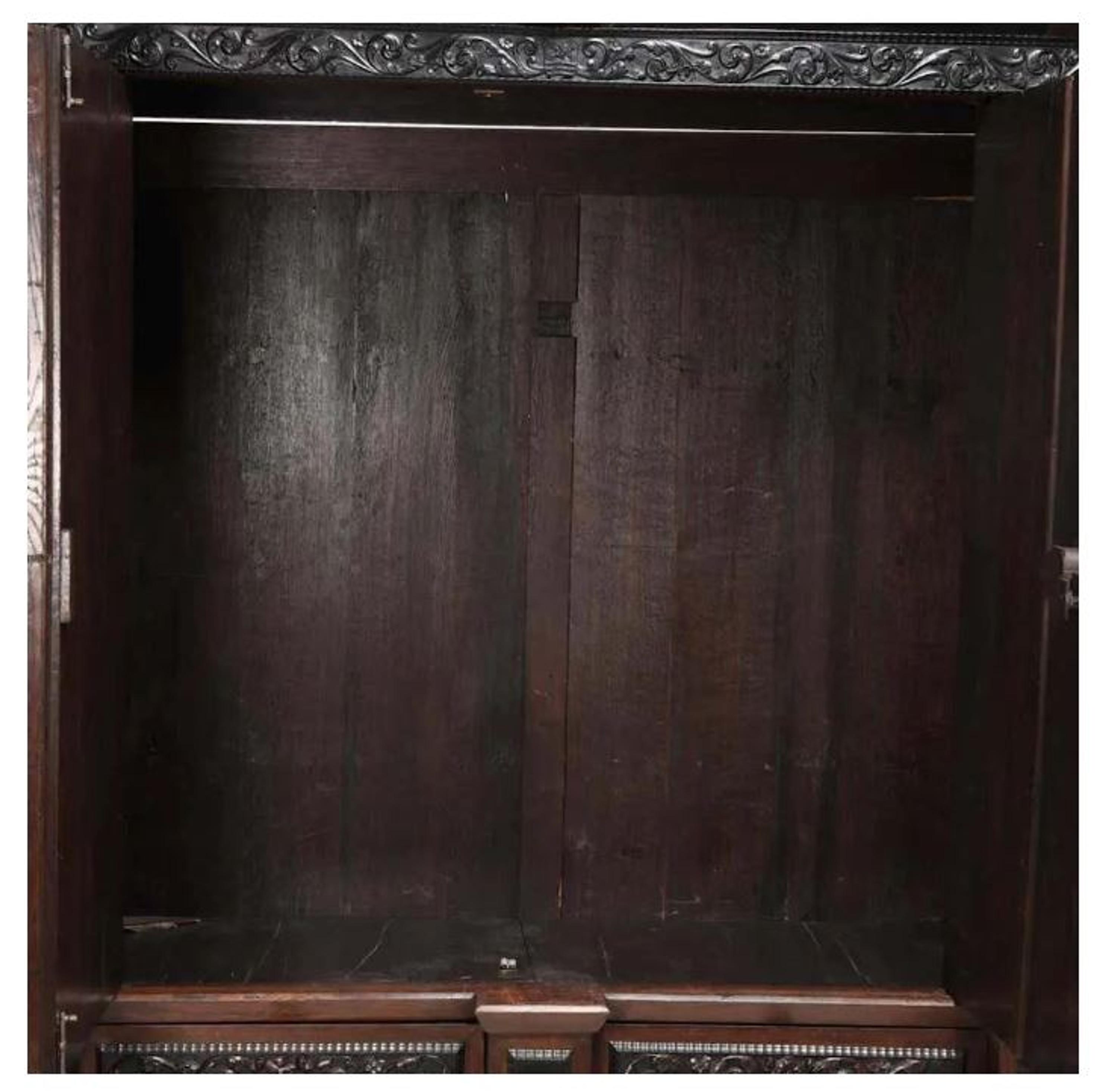 A Flemish Part-Ebonized Carved Rosewood Armoire — 17TH/18TH CENTURY