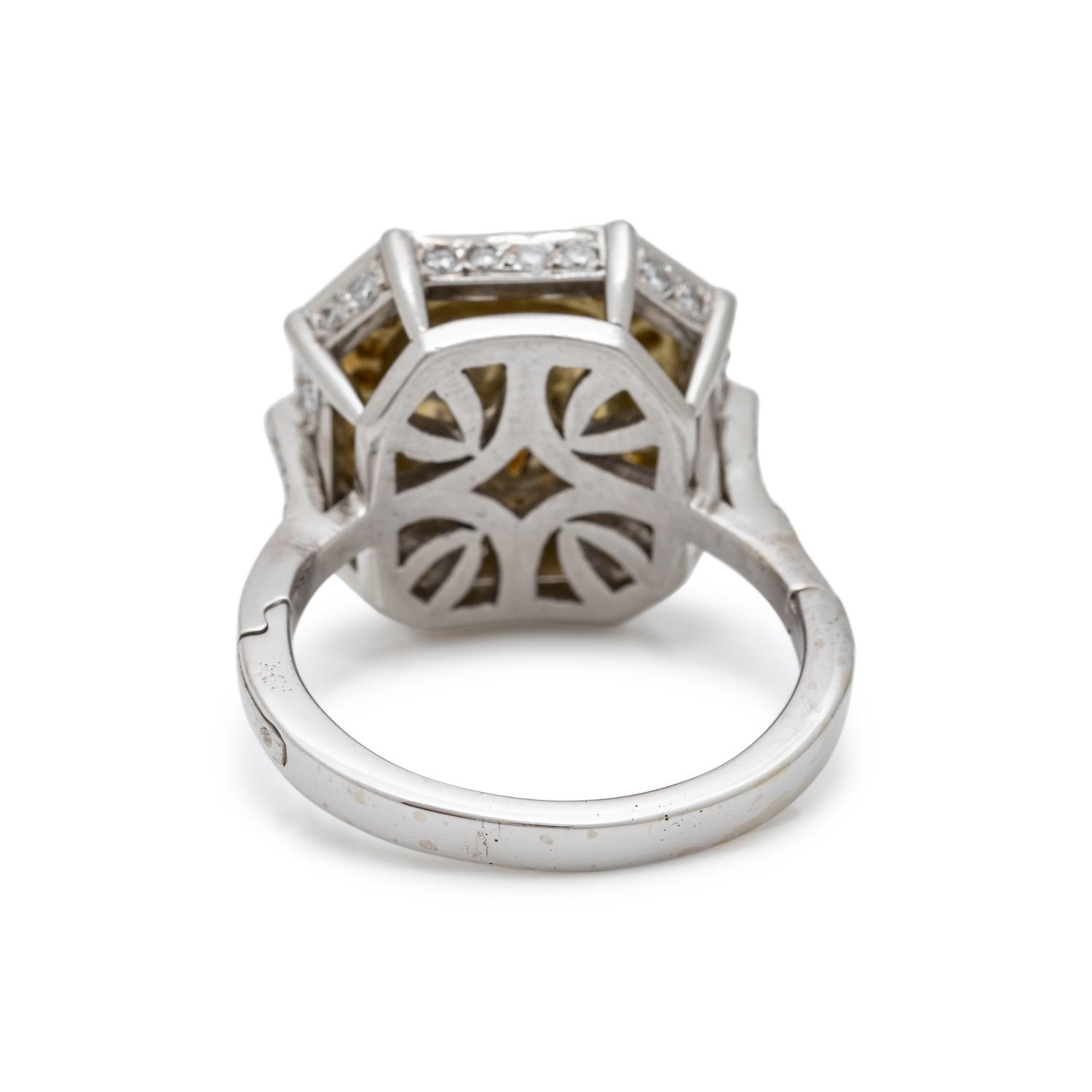 FANCY LIGHT YELLOW DIAMOND AND DIAMOND RING