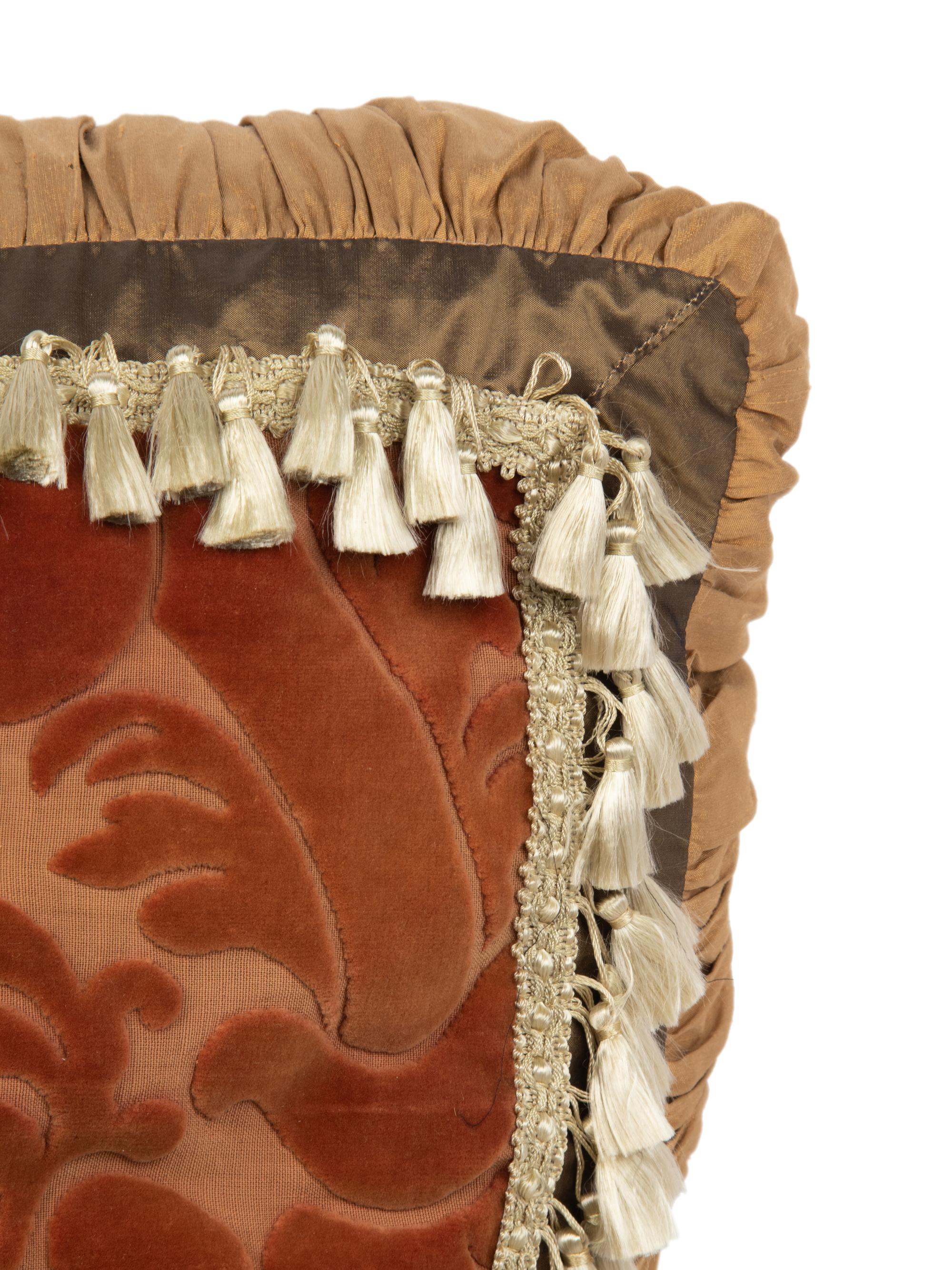 A Set of Three Velvet Upholstered Pillows with Tassels