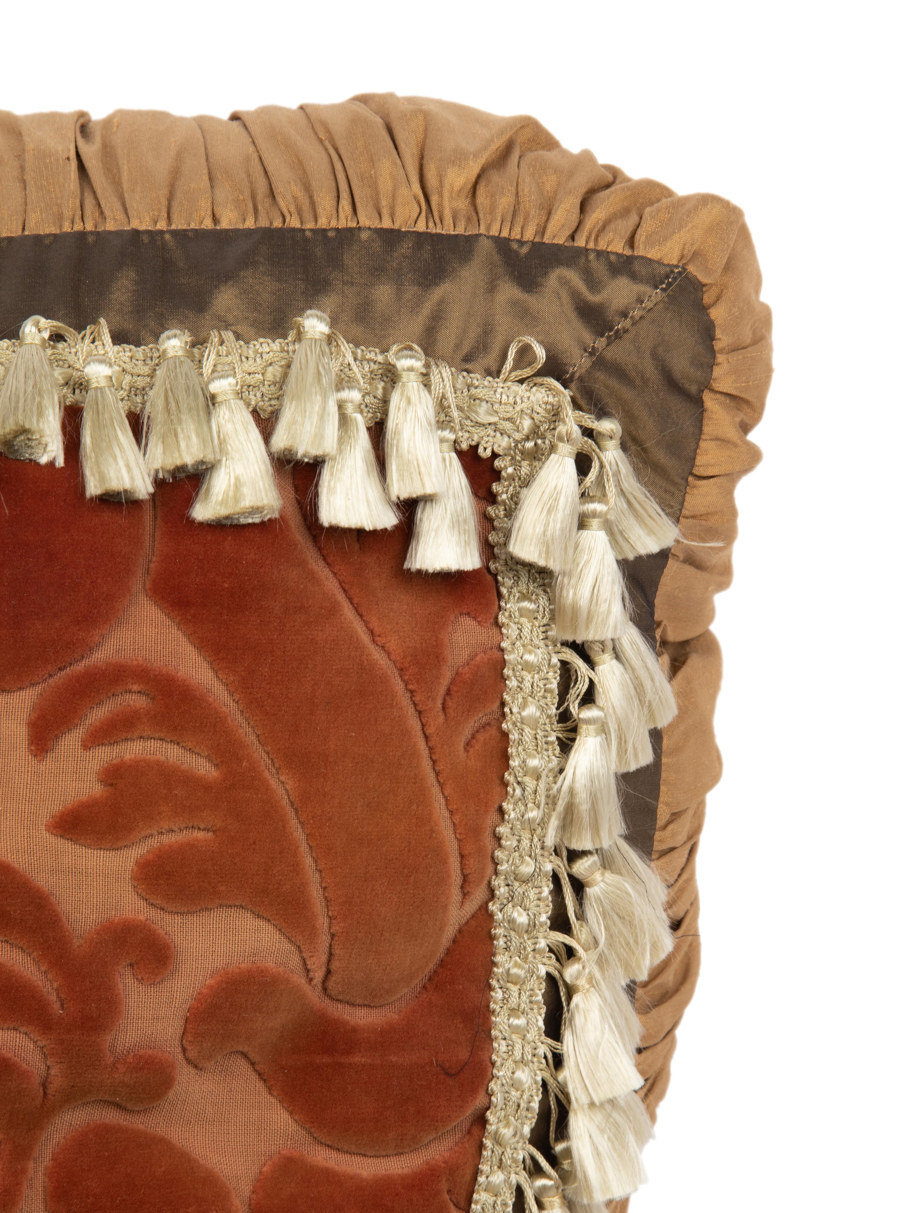 A Set of Three Velvet Upholstered Pillows with Tassels